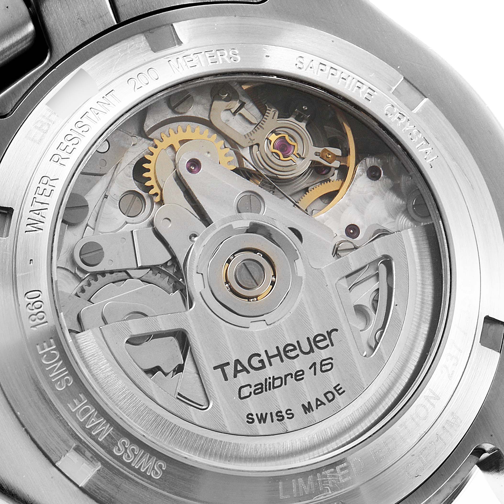 The image shows the back view of a Tag Heuer Link model watch, focusing on the visible internal mechanical movements and engravings.