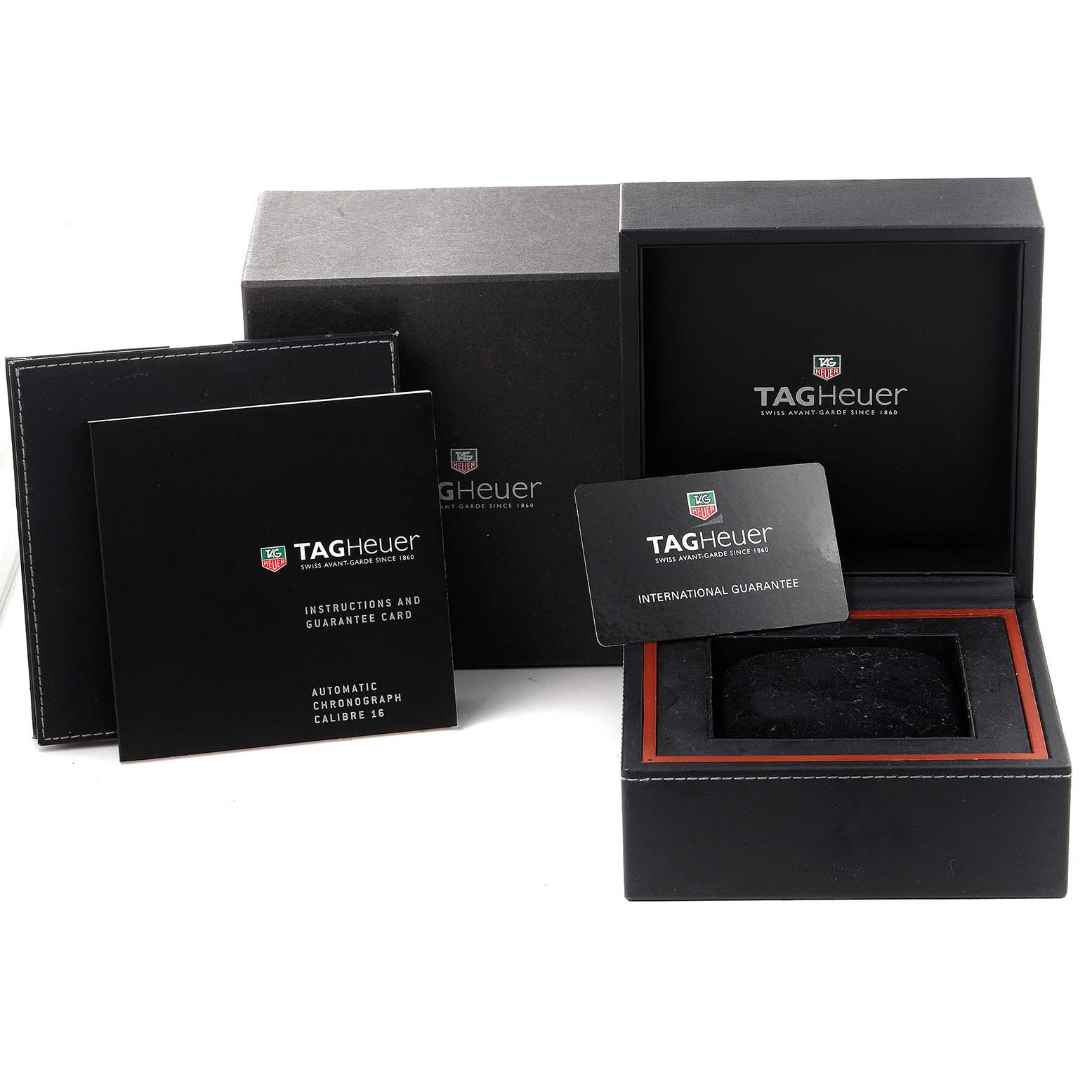 The image shows the packaging and documents of a Tag Heuer Link model watch, including the box, instruction booklet, and guarantee card.