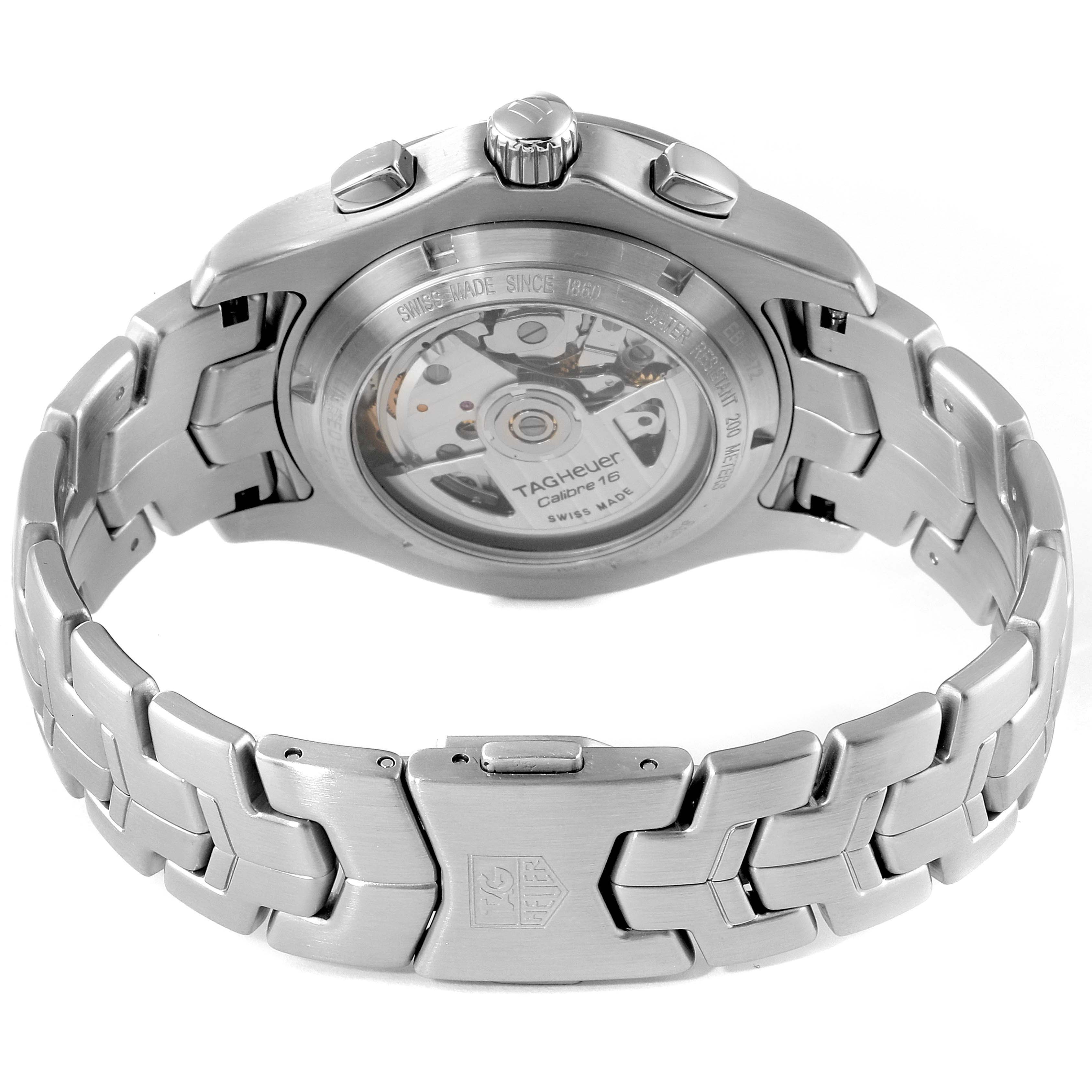 The image shows the back of a Tag Heuer Link watch, highlighting the automatic movement and bracelet.