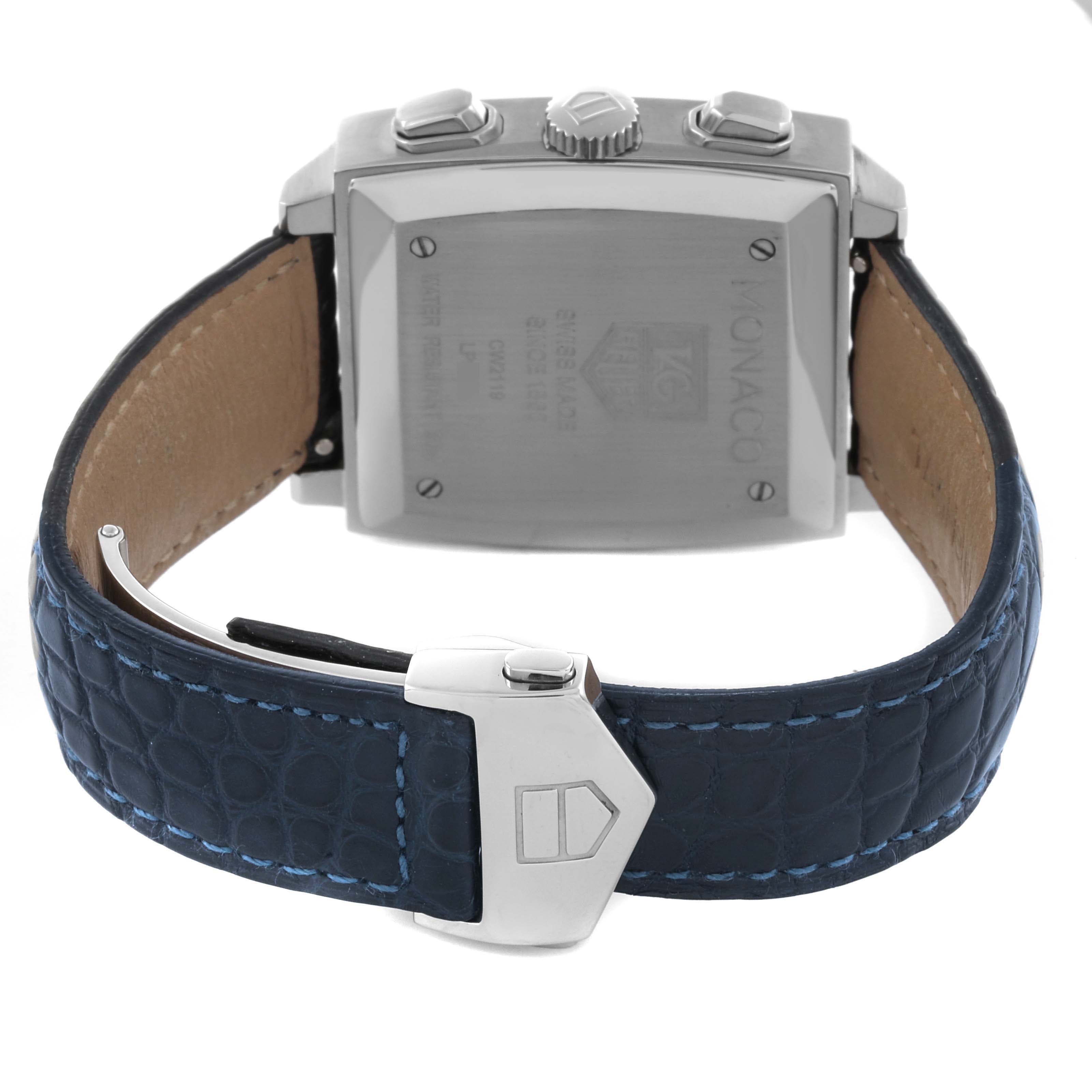 The image shows the back case and clasp of a Tag Heuer Monaco CW2119 Men's Stainless Steel Mother of Pearl Dial CW2119 Men's Stainless Steel Mother of Pearl Dial watch, highlighting its blue leather strap.
