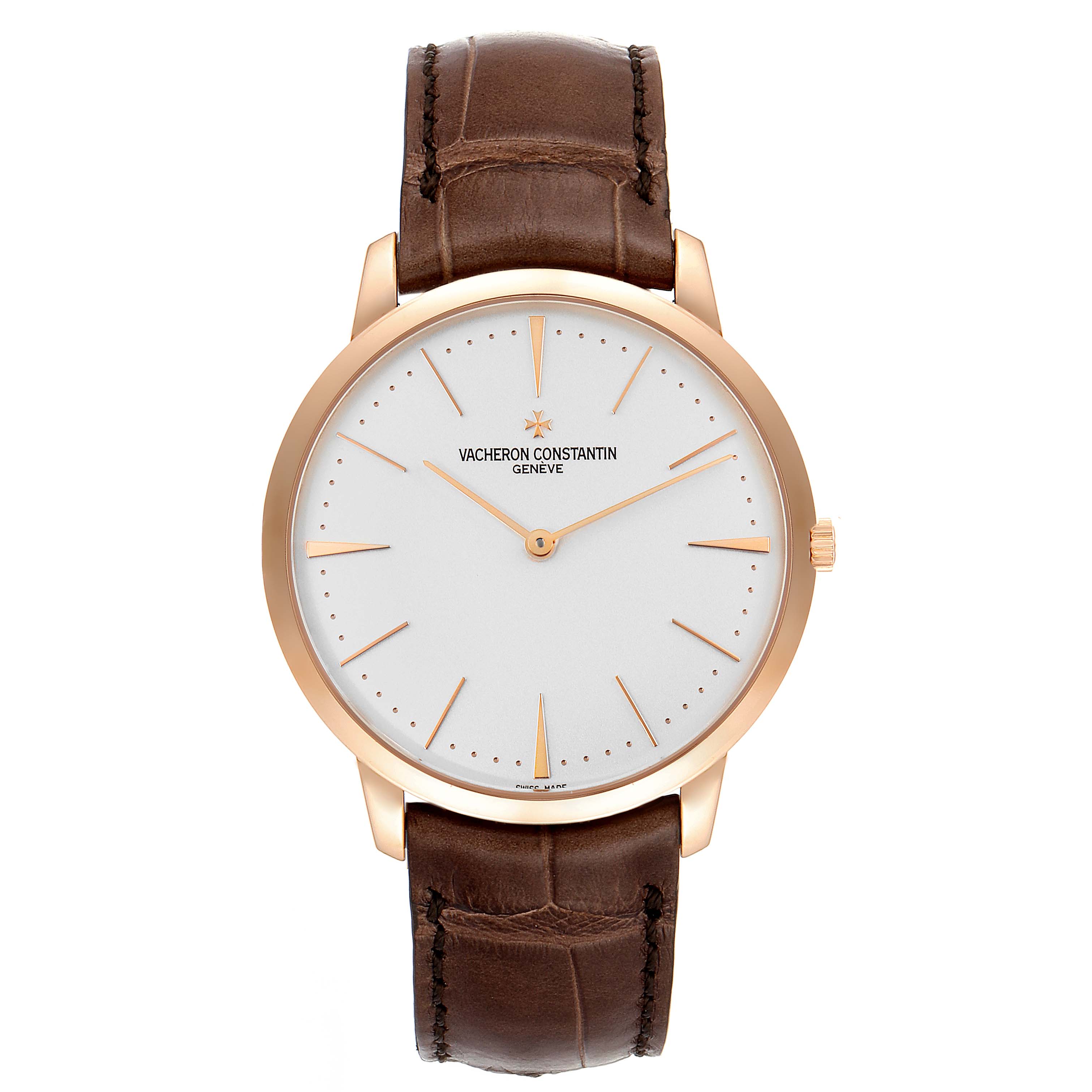 The Patrimony by Vacheron Constantin is shown from a front angle, displaying its white dial, gold case, and brown leather strap.