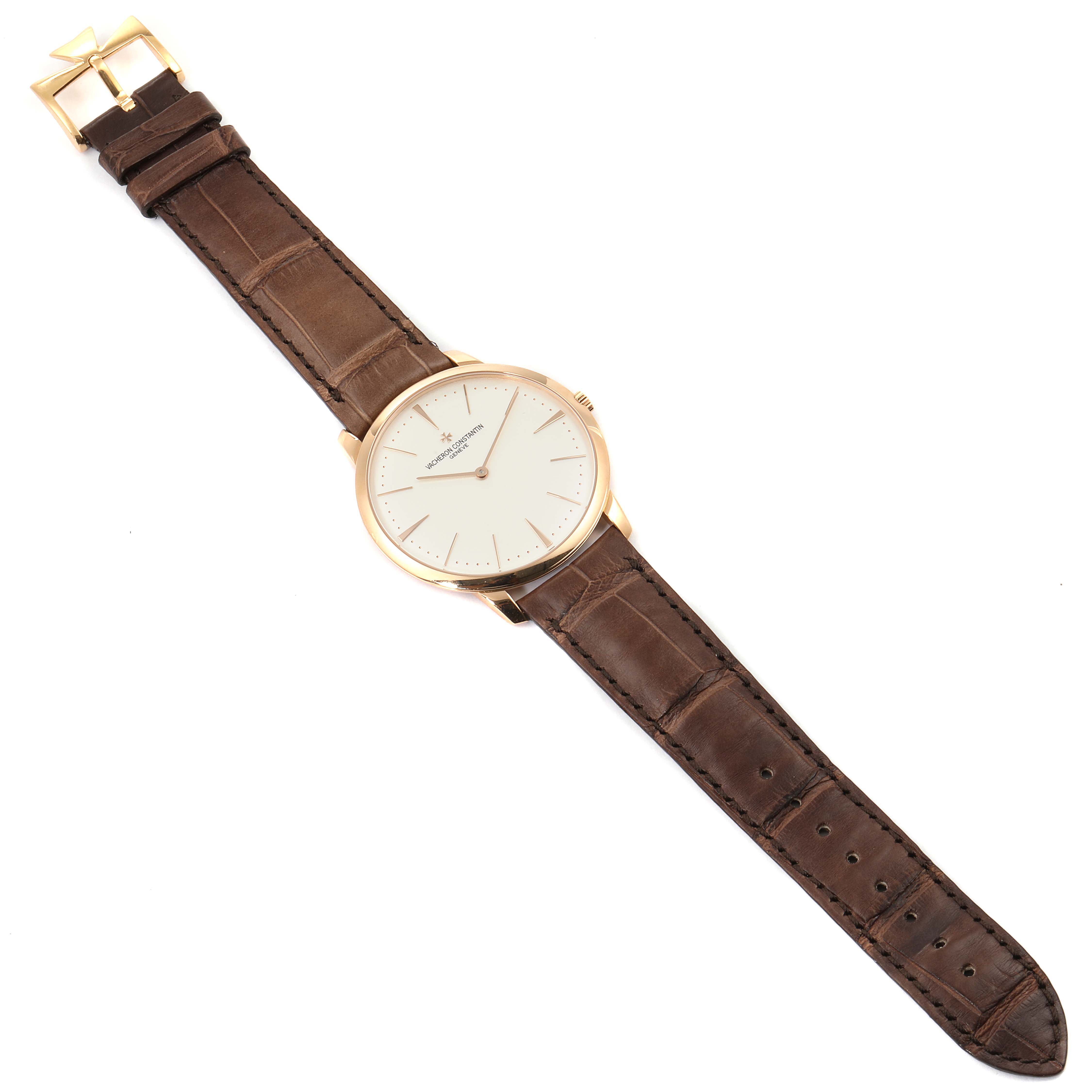 The Vacheron Constantin Patrimony 81180/000R-9159 Men's Rose Gold Silver Dial 81180/000R-9159 Men's Rose Gold Silver Dial watch is shown from a top-down angle, displaying its face, brown leather strap, and gold buckle.