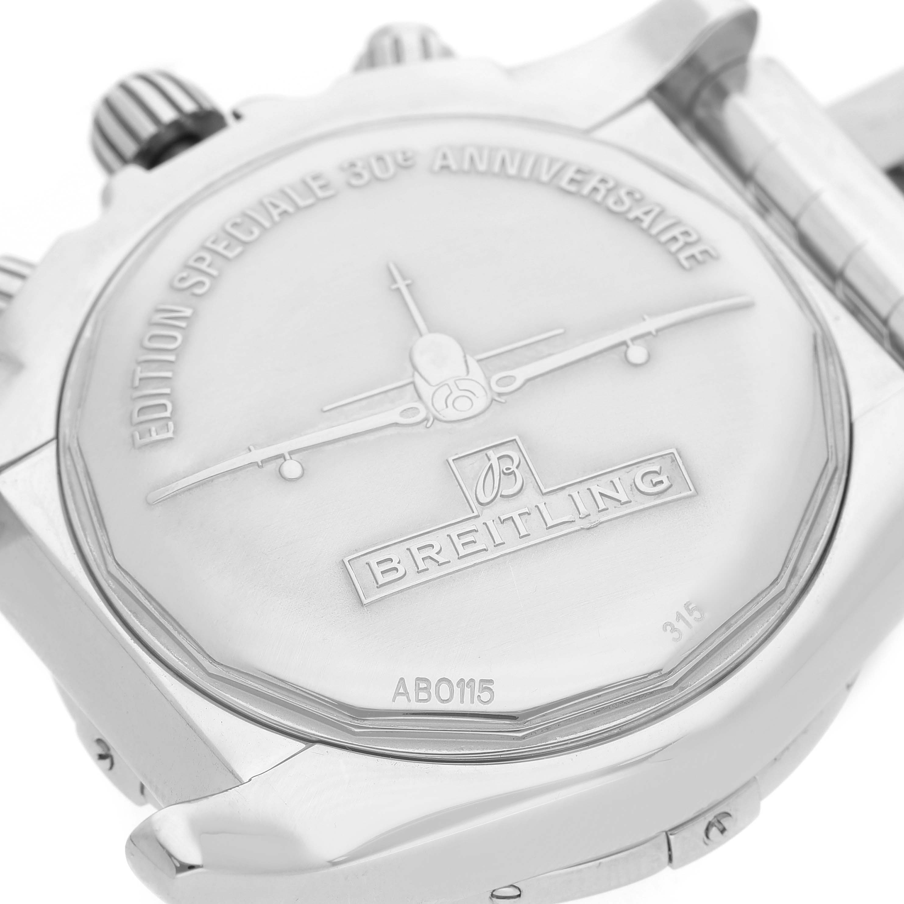 The image shows the back case of the Breitling Chronomat AB01154G/BD13 Men's Stainless Steel Black Dial watch, focusing on its engraved design and branding details.