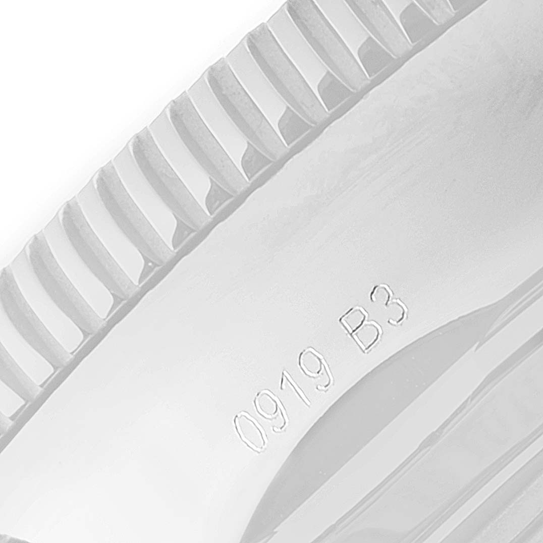 The image shows a close-up angle of the bezel of a Breitling Superocean A13320 Men's Stainless Steel Black Dial A13320 Men's Stainless Steel Black Dial watch, highlighting its ridged edge and engraved numbers.