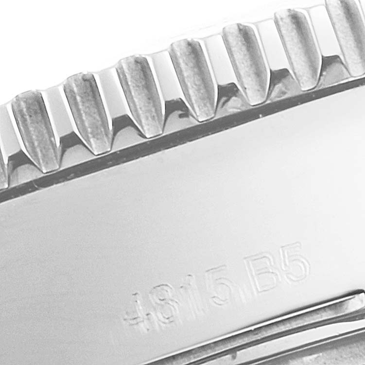 This image shows a close-up of the bezel and a part of the case with engravings on a Breitling A17312 Women's Stainless Steel White Dial A17312 Women's Stainless Steel White Dial Superocean II 36 Hurricane White Dial Ladies Watch A17312.