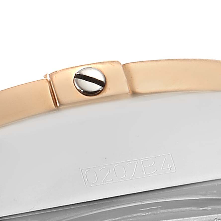 This image shows a close-up of the clasp and part of the bracelet of the Breitling Windrider C49350 Men's Steel and Gold (two tone) Mother of Pearl Dial C49350 Men's Steel and Gold (two tone) Mother of Pearl Dial watch, featuring a screw and partial serial number.