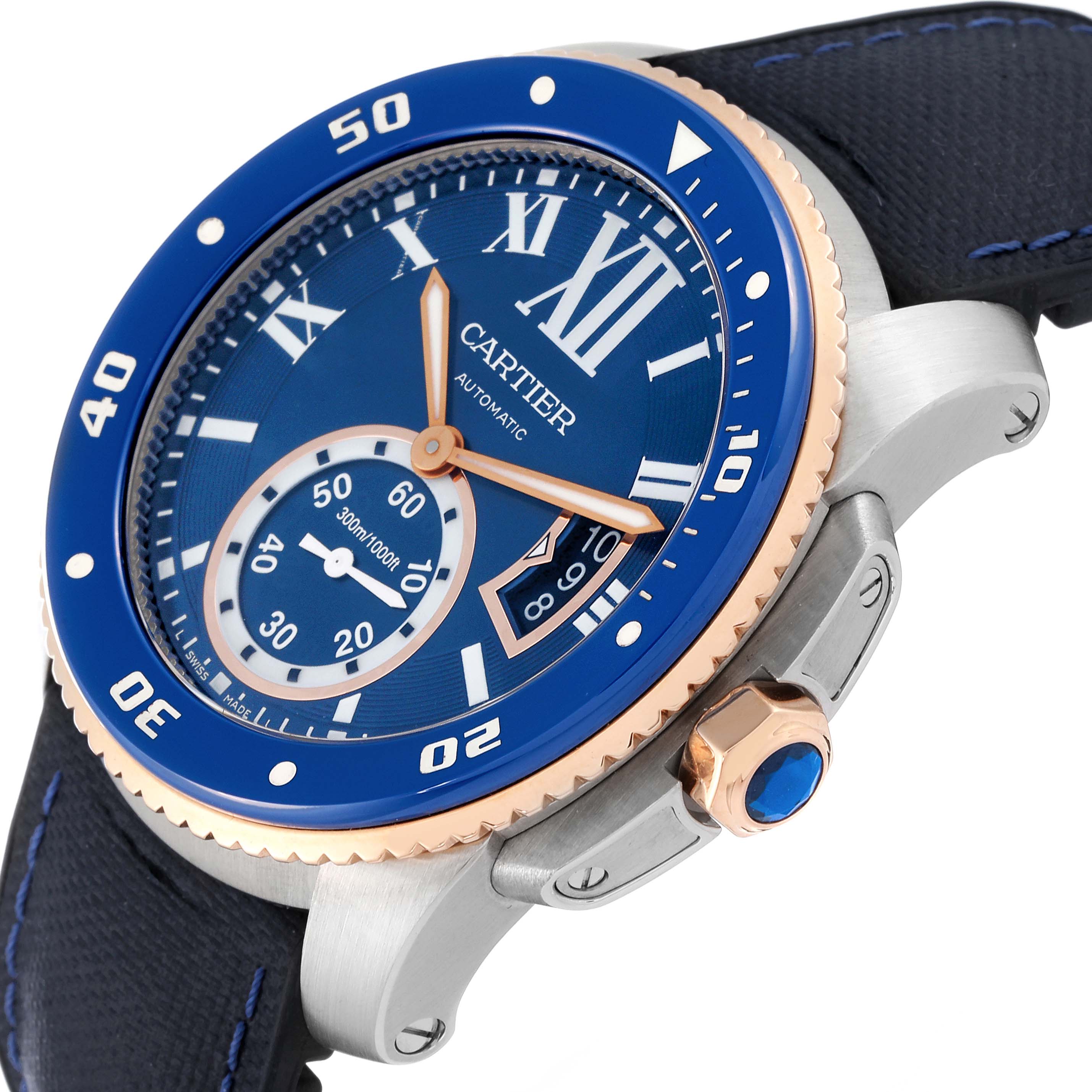 This image shows a tilted view of the Calibre de Cartier watch by Cartier, highlighting its blue bezel, dial, and crown.