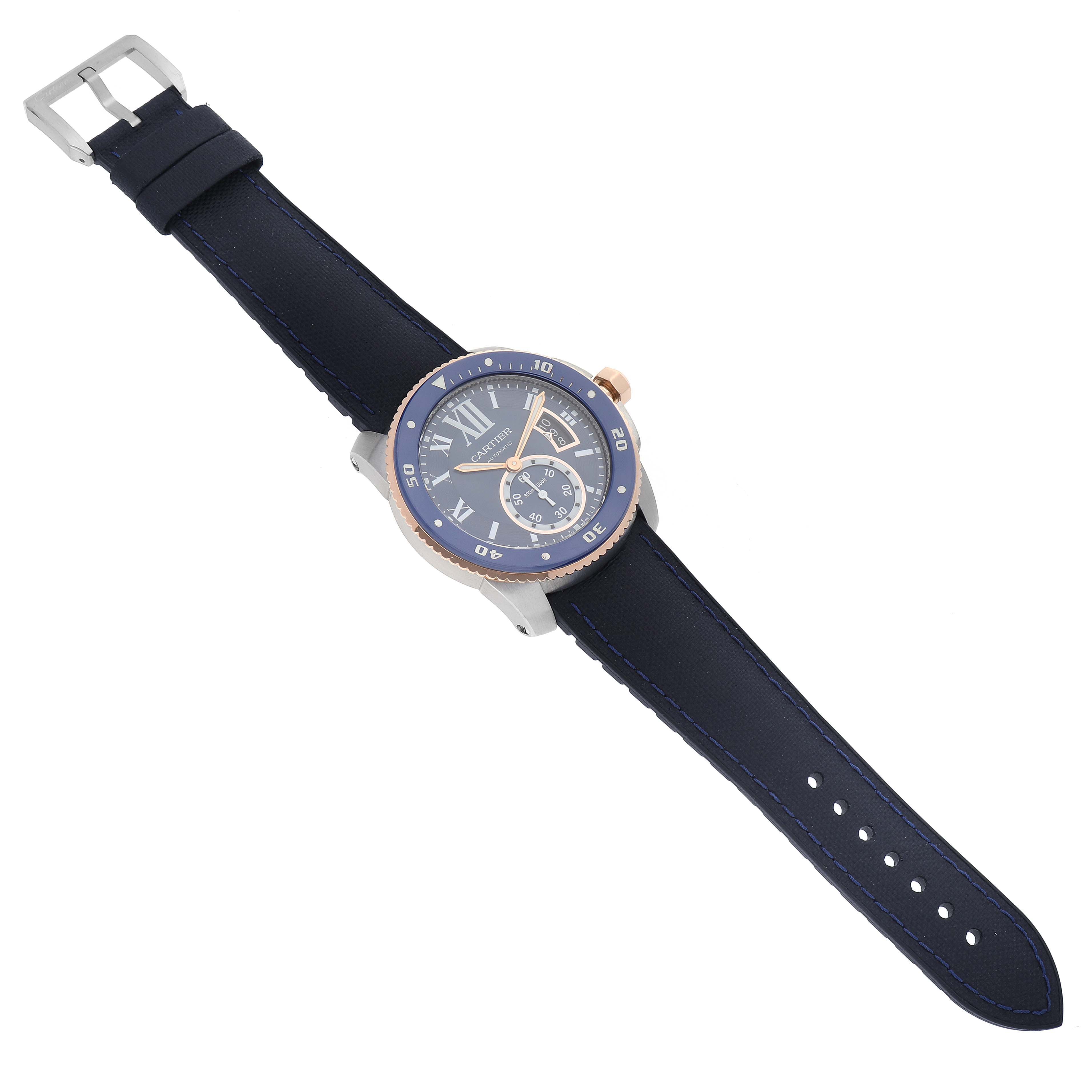 The image shows a Calibre de Cartier watch by Cartier, angled to display its face, band, and buckle.