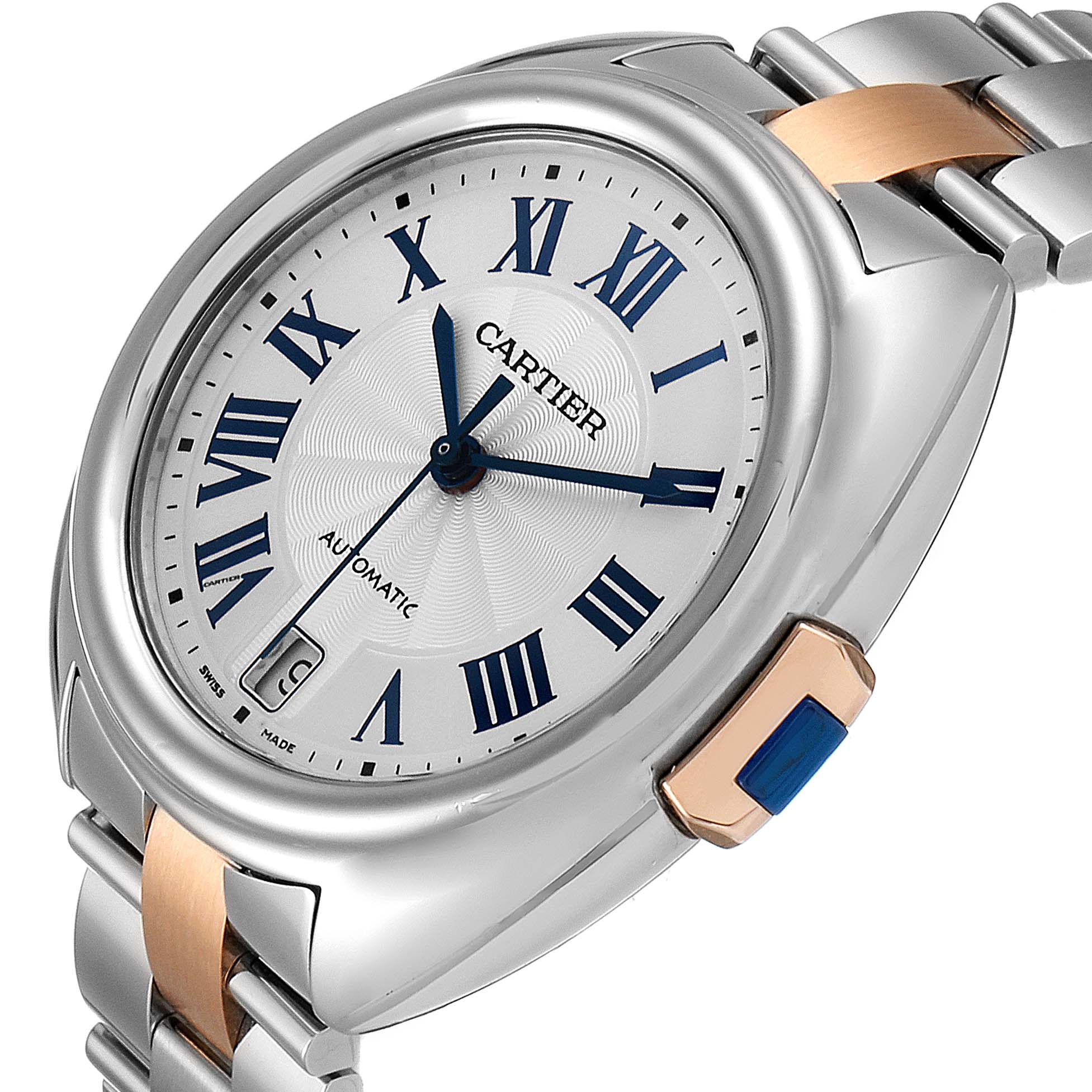 The image shows a close-up angle of the Cartier Clé watch face, showcasing its Roman numerals, blue hands, and part of the metal band.