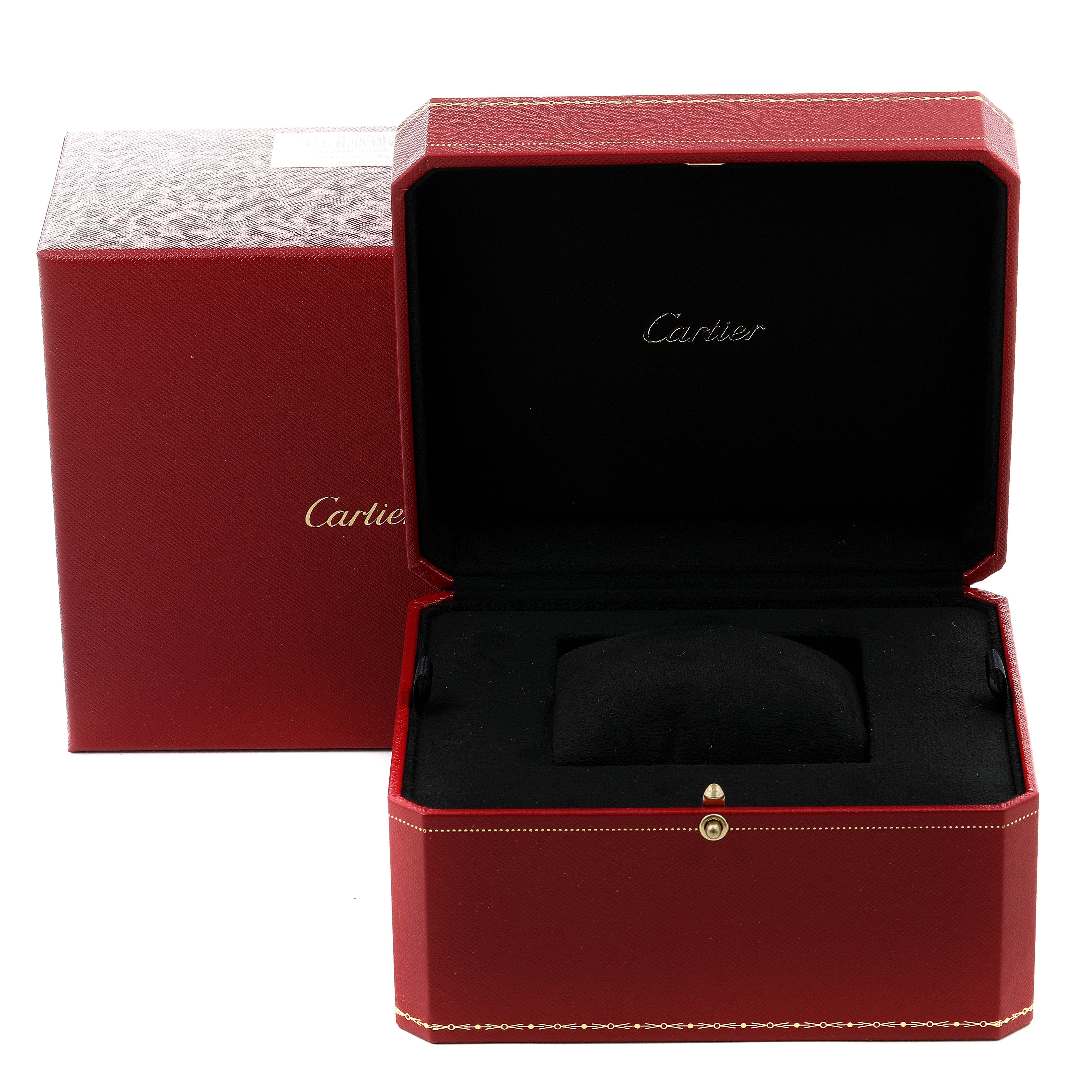 The image shows a red Cartier watch box for a Cle model, with the lid open and the interior cushioning visible.