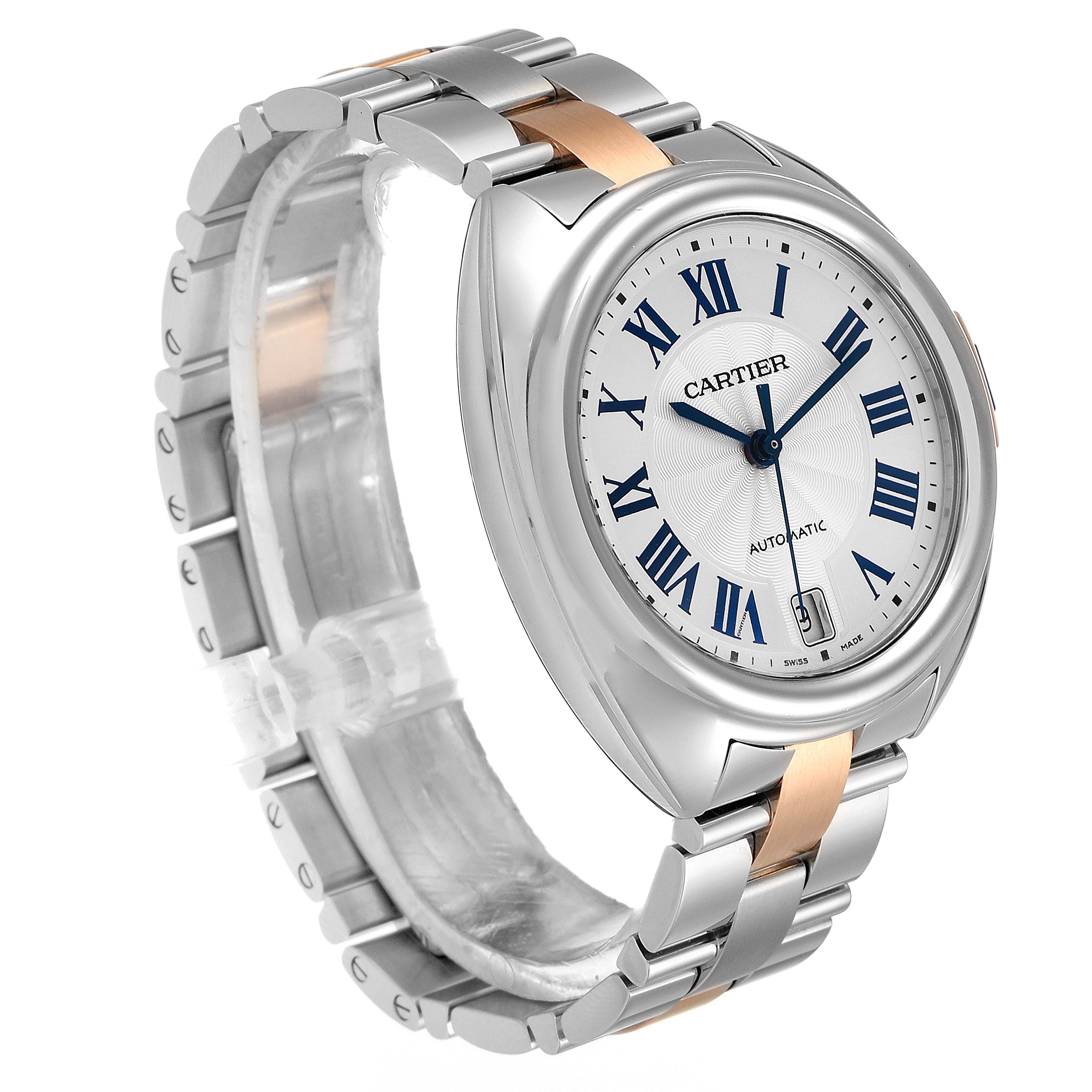 The image shows a side angle view of the Cartier Clé watch, highlighting its face and two-tone metal band.