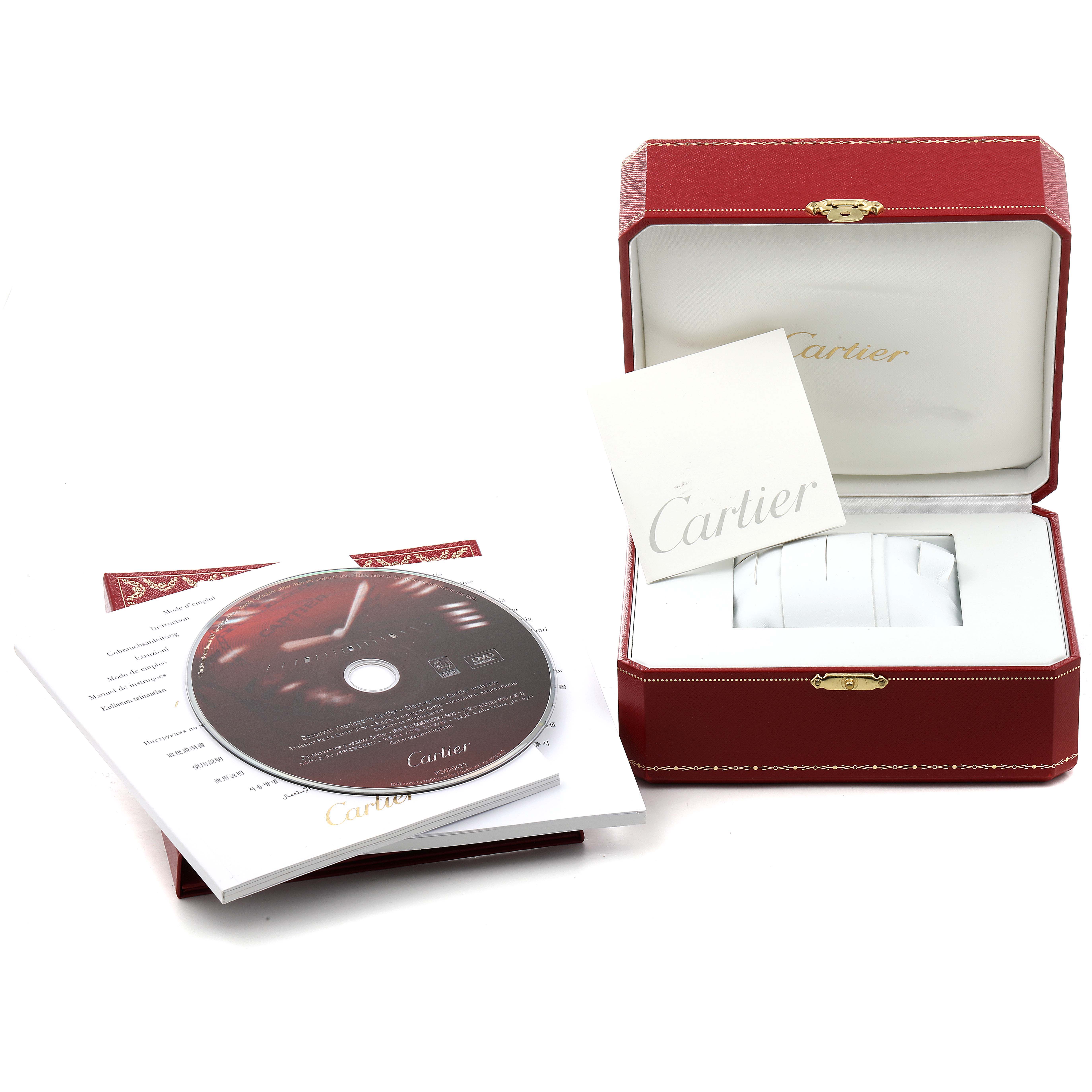 The image shows the packaging, manuals, and a CD for the Cartier Must 21 W10197U2 Women's Stainless Steel White Dial W10197U2 Women's Stainless Steel White Dial watch model.