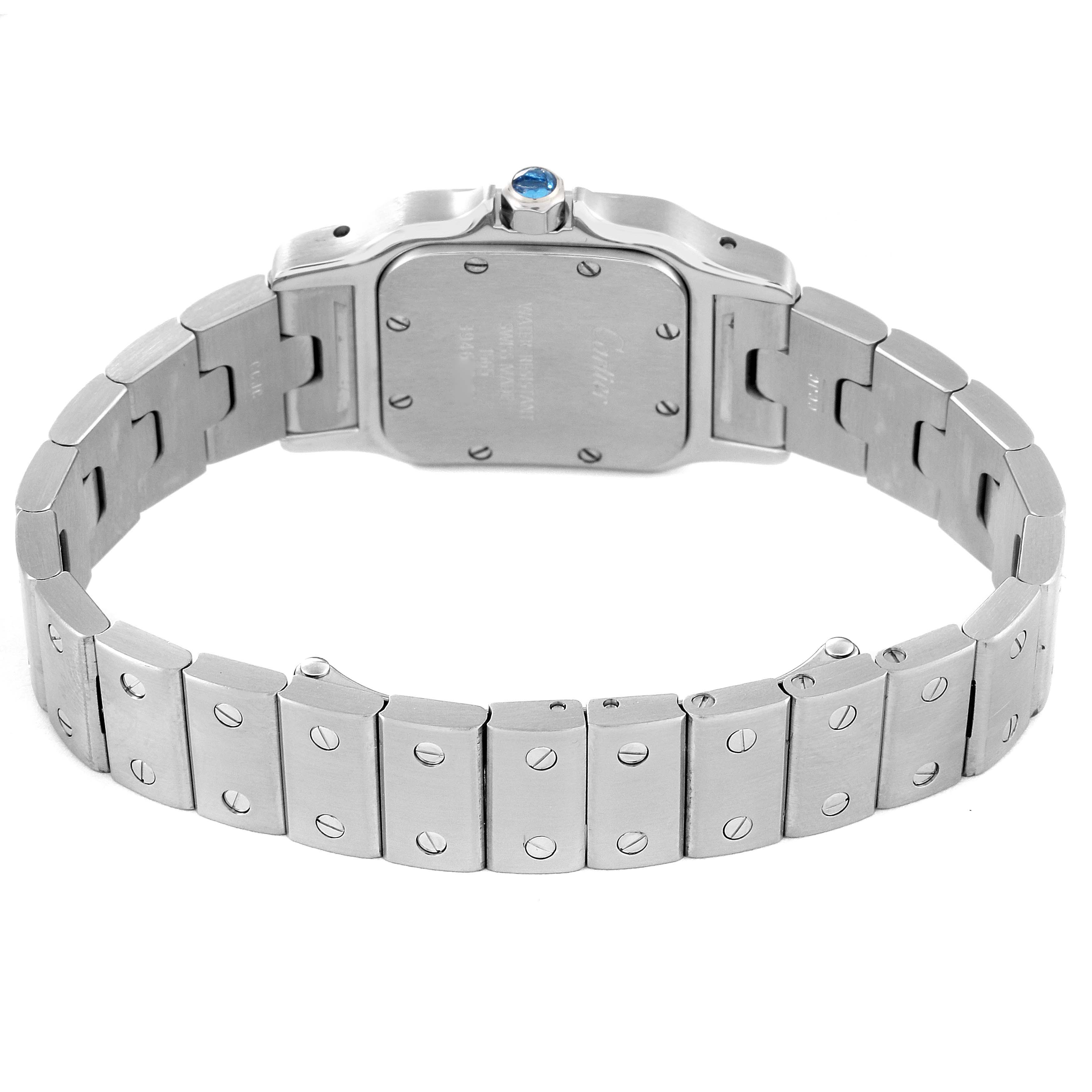 The image shows the back view of a Cartier Santos W20056D6 Women's Stainless Steel Silver Dial W20056D6 Women's Stainless Steel Silver Dial watch, highlighting its stainless steel case and bracelet with screw details.