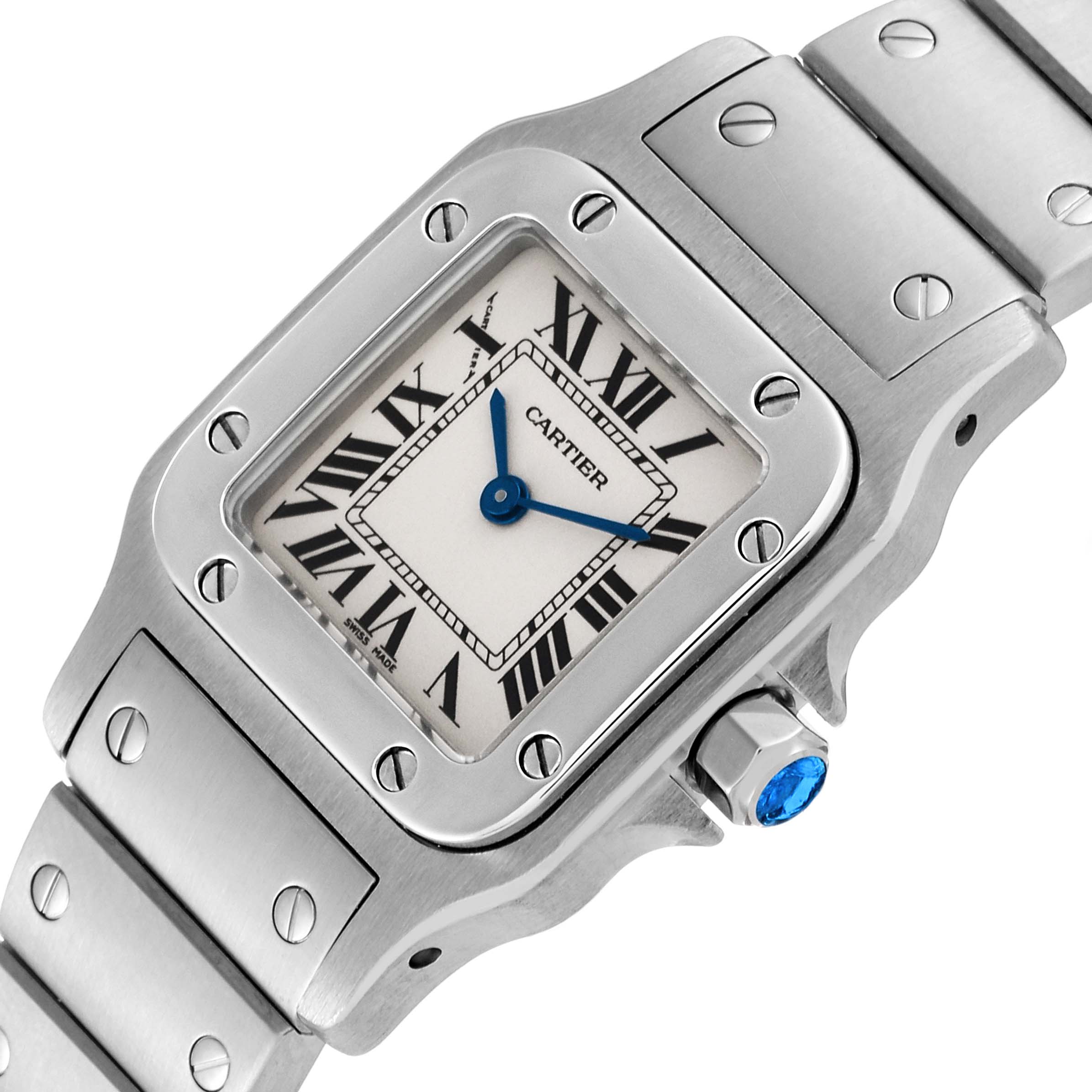 The image shows a close-up of the Cartier Santos W20056D6 Women's Stainless Steel Silver Dial W20056D6 Women's Stainless Steel Silver Dial watch face, crown, and part of the band from an angled perspective.