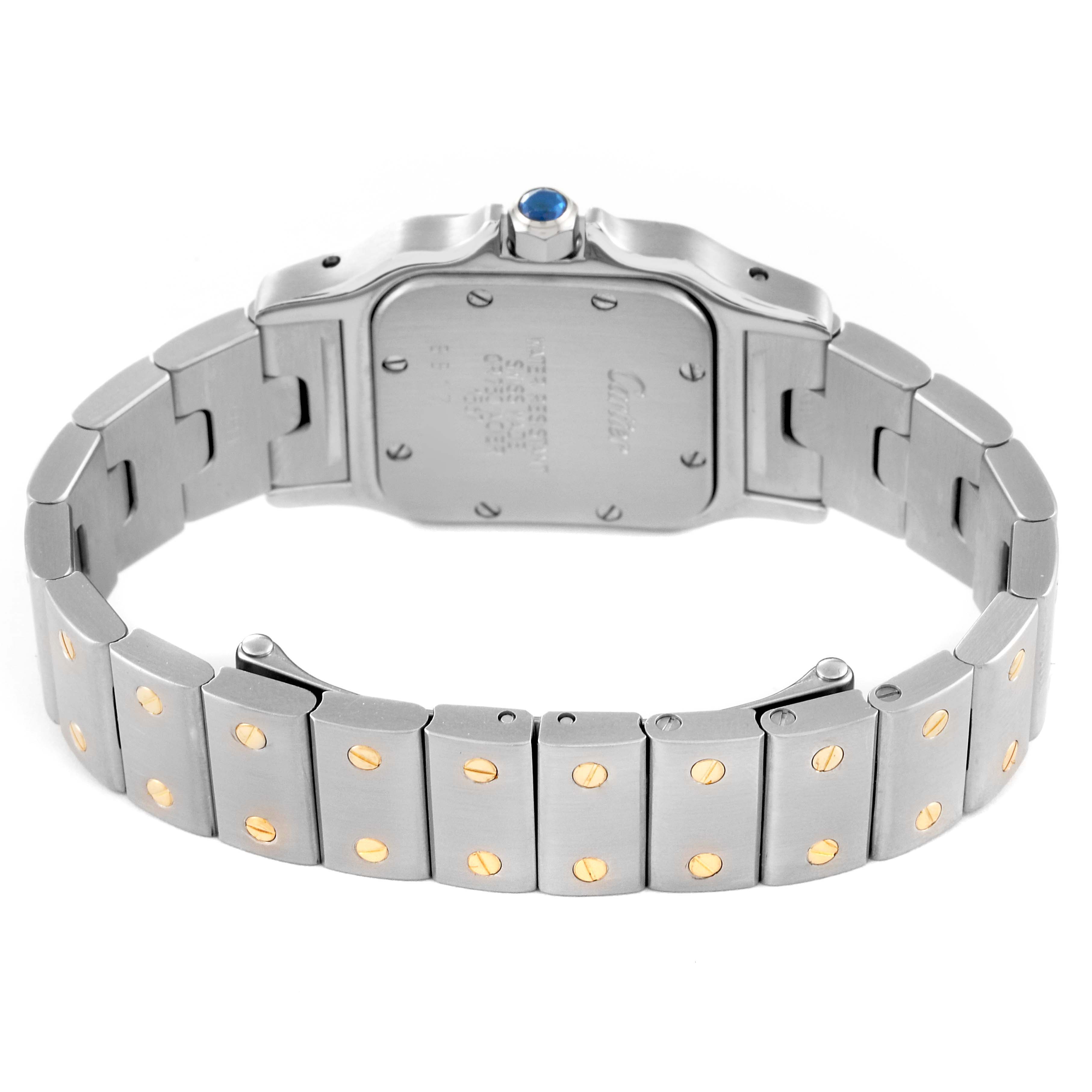 This image shows the back of a Santos watch by Cartier, highlighting the metal bracelet and clasp.