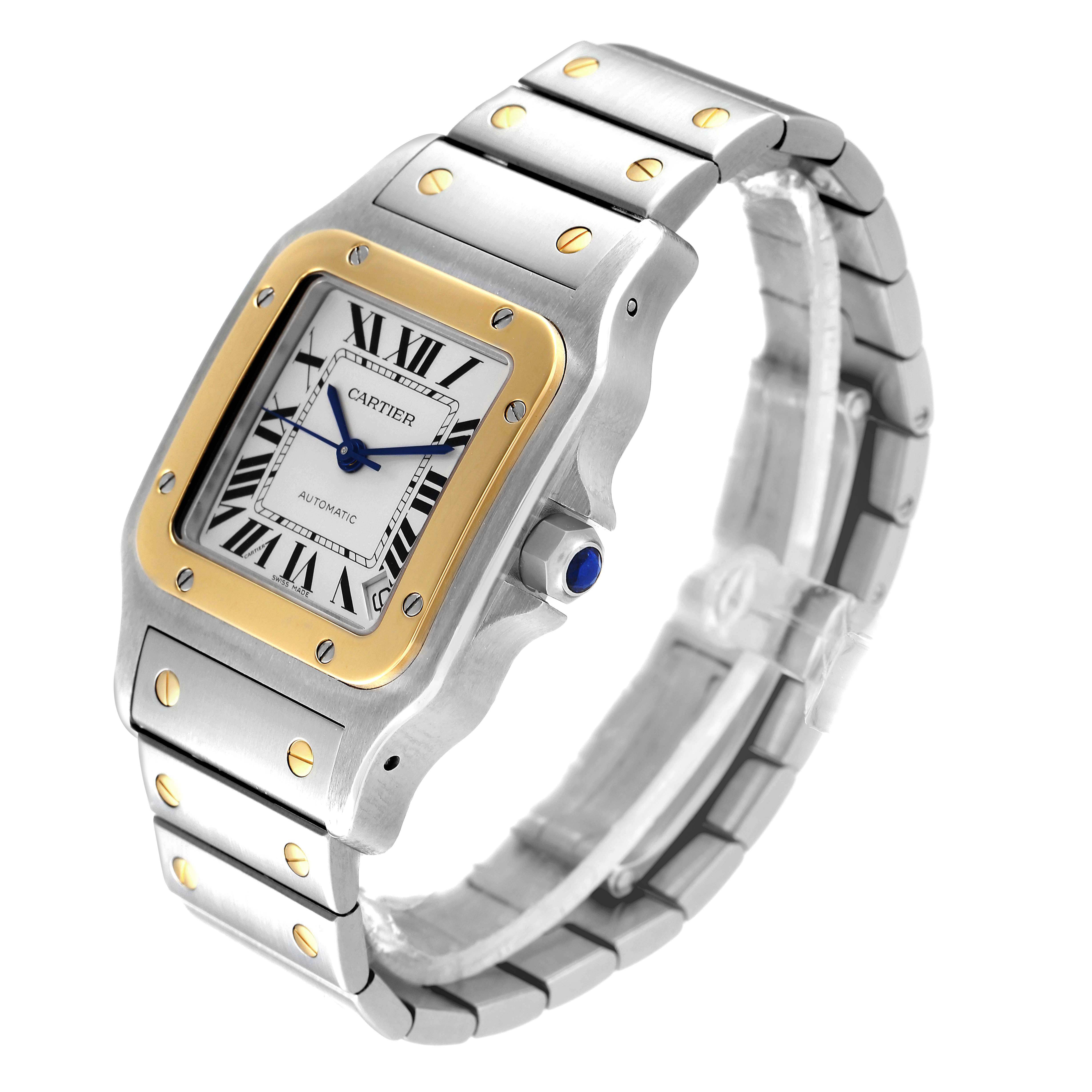 The Cartier Santos W20099C4 Men's Steel and Gold (two tone) Silver Dial W20099C4 Men's Steel and Gold (two tone) Silver Dial watch is shown at an oblique angle, highlighting its face, bezel, crown, and bracelet.