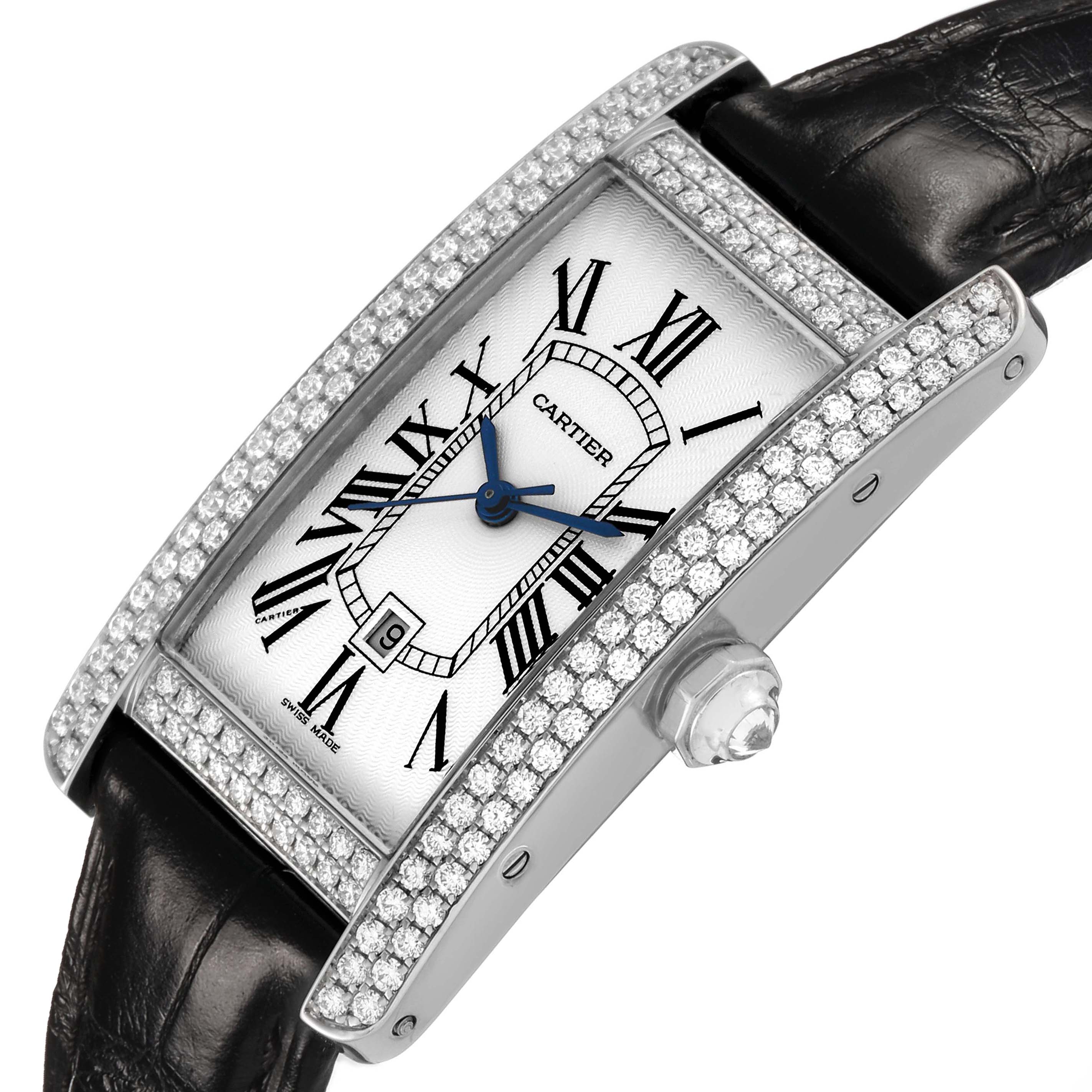 The Cartier Tank Americaine WB710002 Women's White Gold Silver Dial watch is shown at an angled side view, highlighting its diamond-edged case and black leather strap.