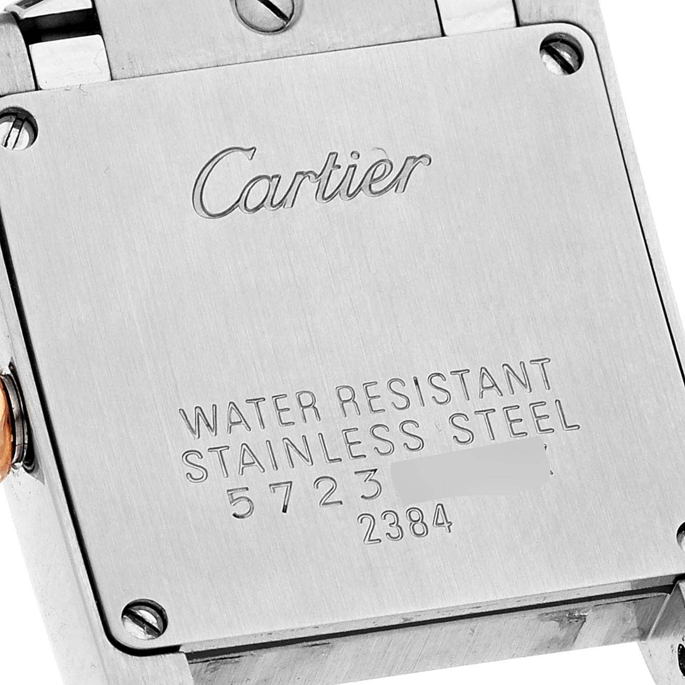 This image shows the stainless steel case back of a Cartier Tank Française watch at a close-up angle.