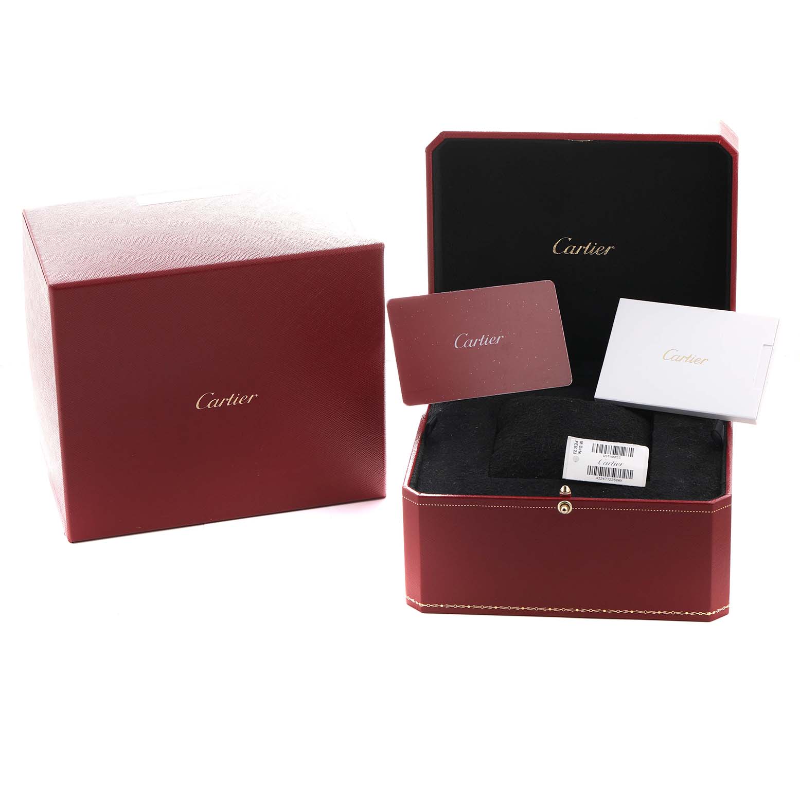 The image shows a Cartier Tank Must WSTA0053 Men's Stainless Steel Silver Dial watch box set at an angle, including packaging, a red box, cards, and protective padding.