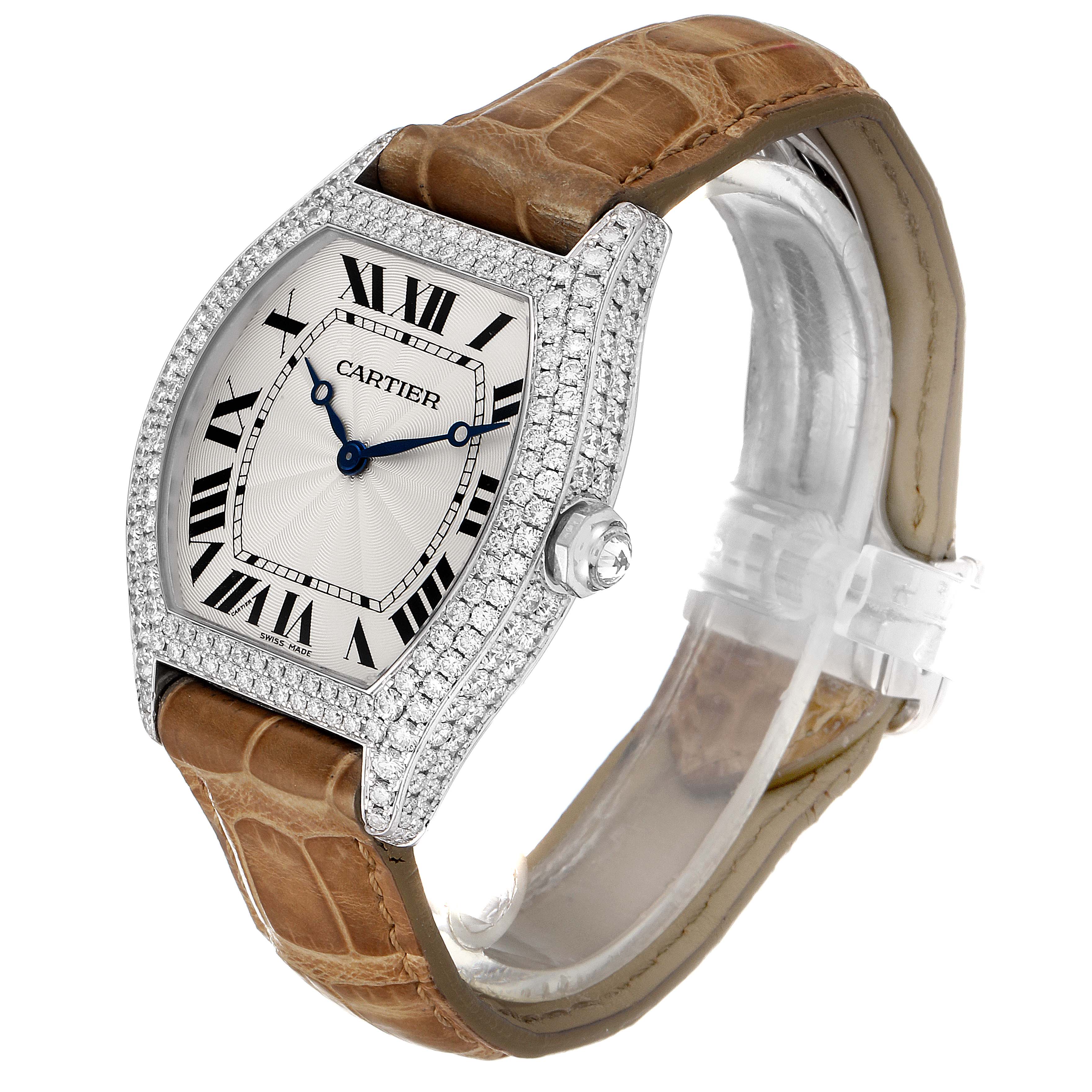This image shows a Cartier Tortue WA504351 Men's White Gold Silver Dial WA504351 Men's White Gold Silver Dial model watch at an angle highlighting its diamond-encrusted case, dial, crown, and leather strap.
