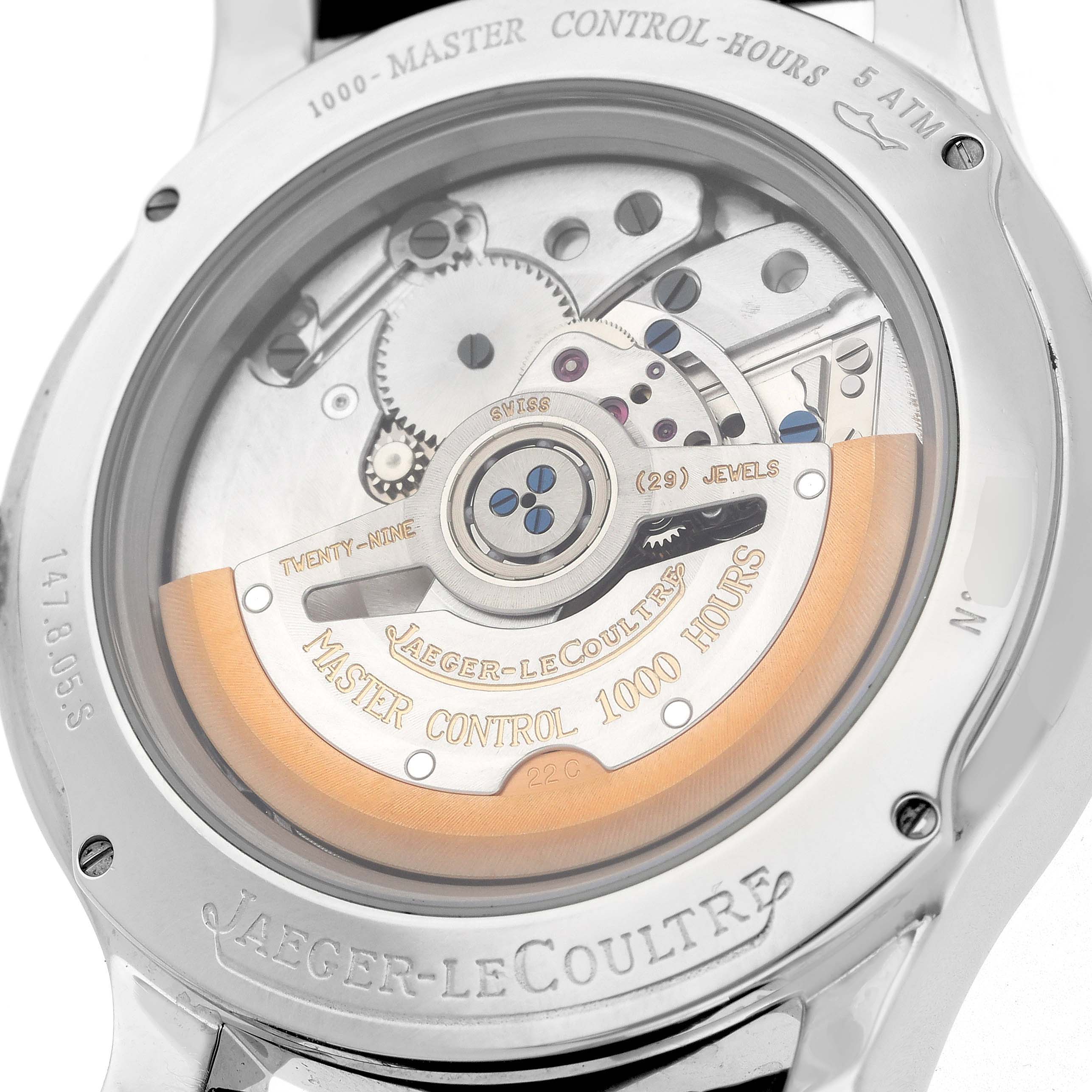 The image shows the back of a Jaeger-LeCoultre Master watch, highlighting its intricate movement and rotor.