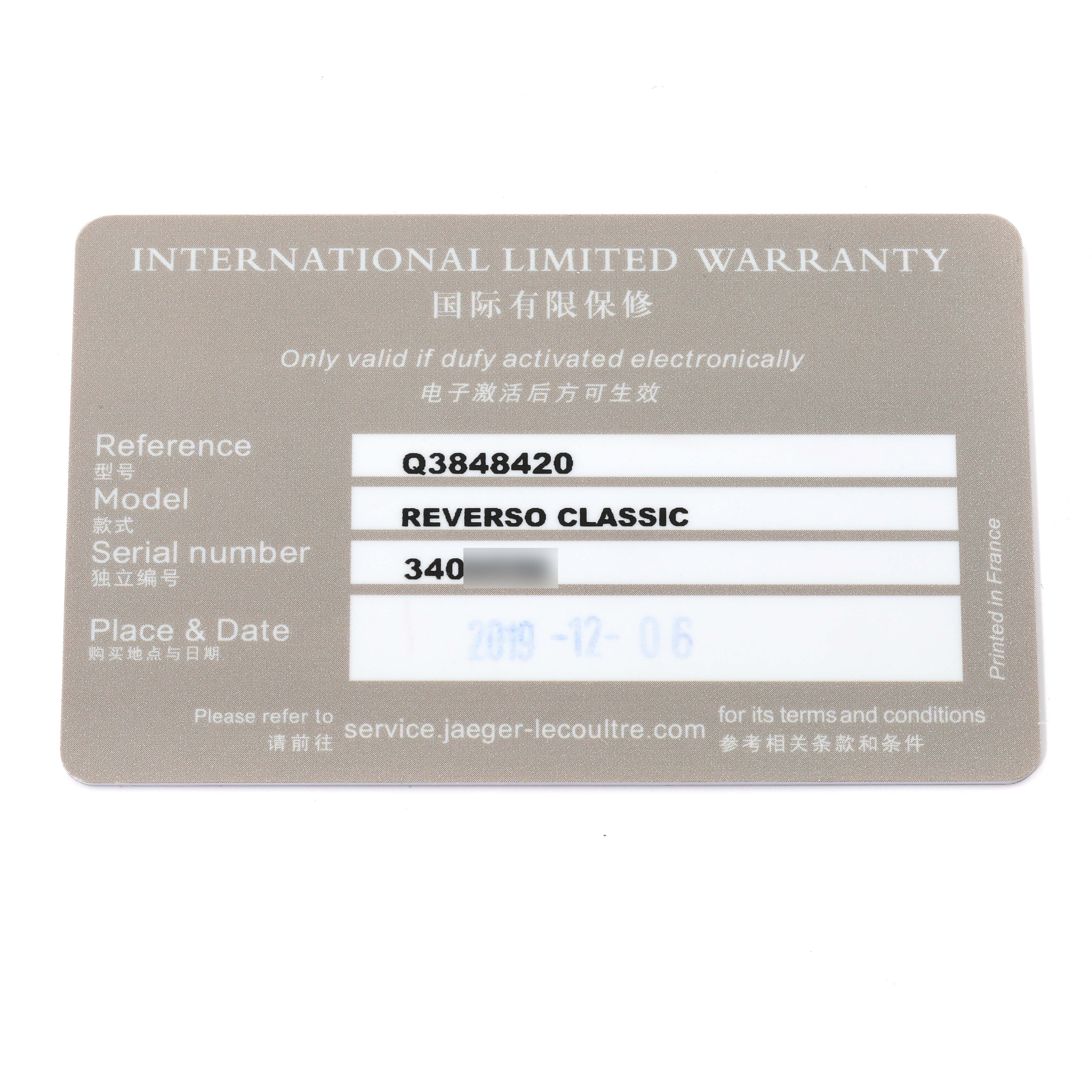 The image shows an International Limited Warranty card for a Jaeger LeCoultre Reverso Q3848420 Men's Stainless Steel Silver Dial Q3848420 Men's Stainless Steel Silver Dial Classic watch, viewed from the top.
