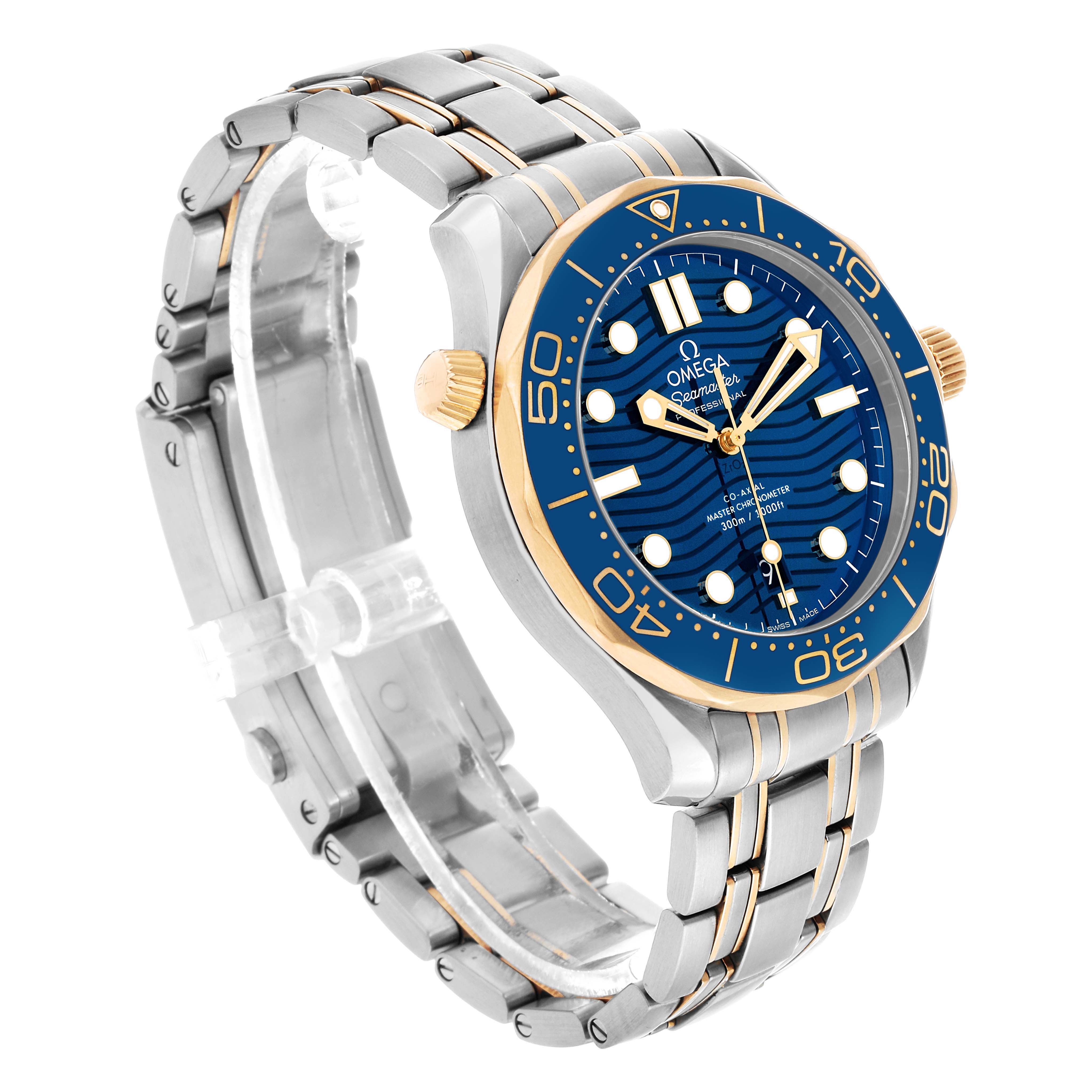 The Omega Seamaster 210.20.42.20.03.001 Men's Steel and Gold (two tone) Blue Dial watch is shown at a three-quarter angle, displaying the face, bezel, crown, and partial bracelet.