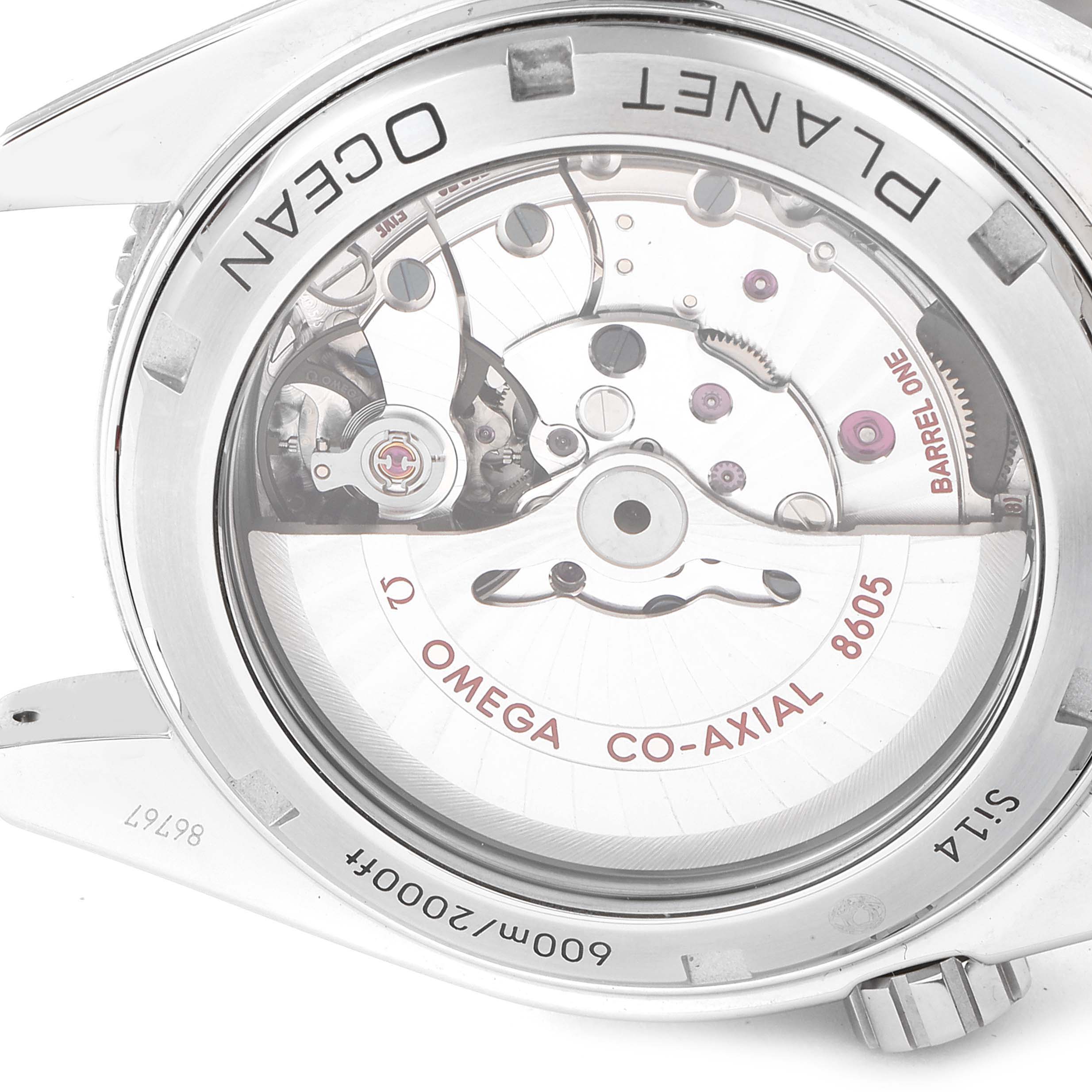 The image shows the back of the Omega Planet Ocean 232.30.44.22.01.002 Men
s Stainless Steel Black Dial 232.30.44.22.01.002 Men
s Stainless Steel Black Dial watch, revealing the intricate movement and "Co-Axial 8605" mechanism.