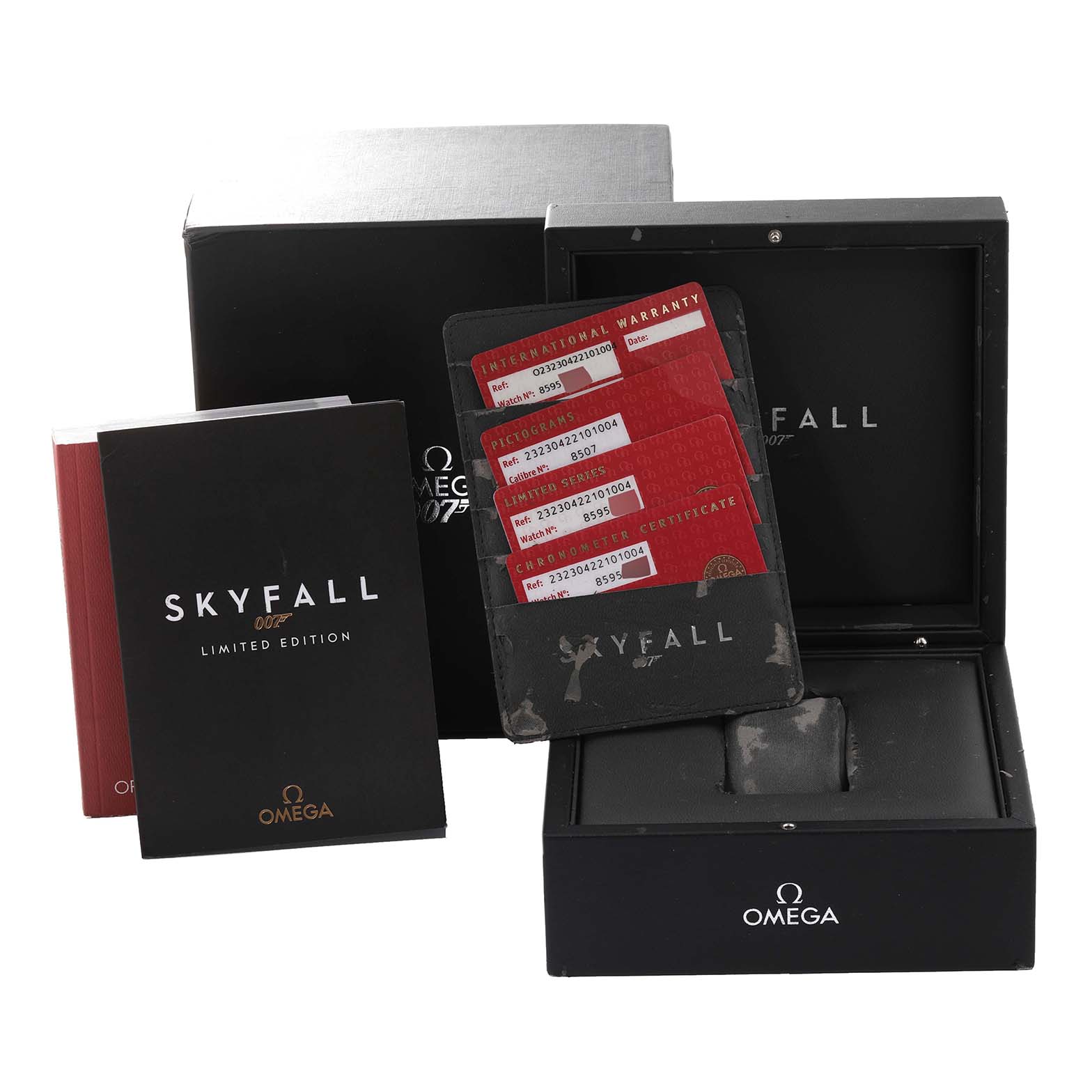 The image shows the Omega Planet Ocean 232.30.42.21.01.004 Men's Stainless Steel Black Dial 232.30.42.21.01.004 Men's Stainless Steel Black Dial Skyfall Limited Edition packaging, including boxes, booklets, and warranty cards.