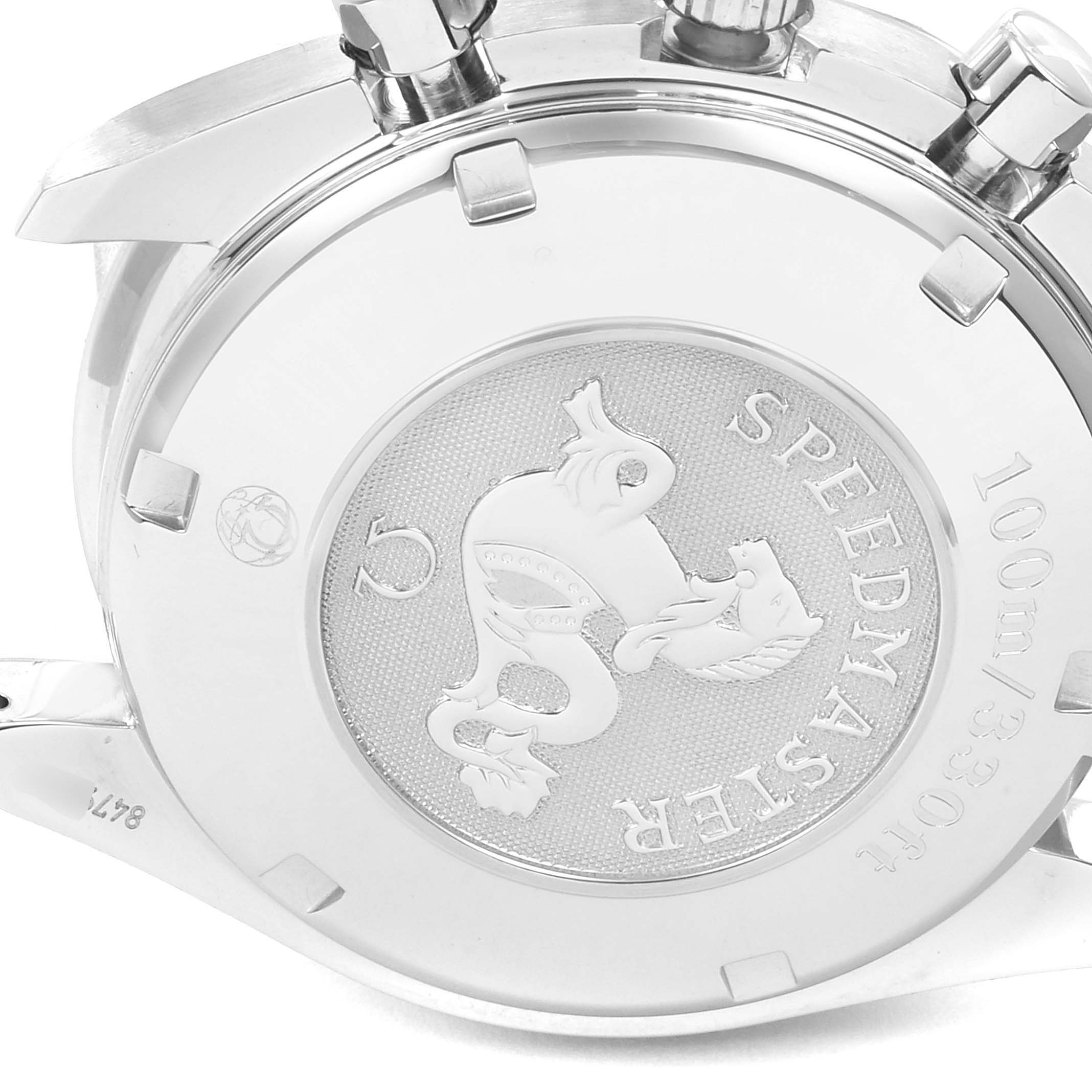 The image shows the case back of an Omega Speedmaster 3210.50.0031391 Men
s Stainless Steel Black Dial 3210.50.0031391 Men
s Stainless Steel Black Dial watch, featuring its emblem and water-resistance details.