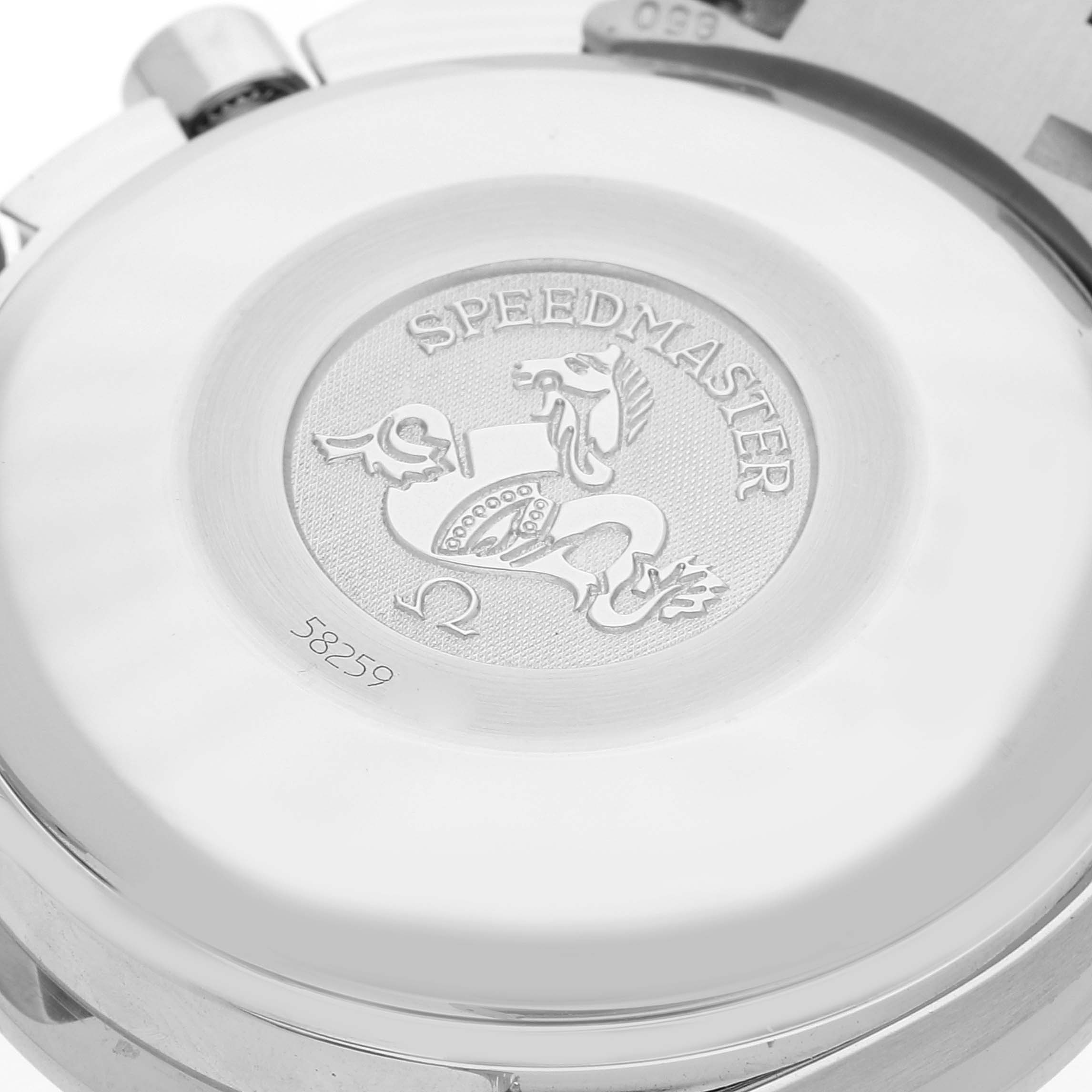 The image shows the case back of an Omega Speedmaster 3513.50.00 Men
s Stainless Steel Black Dial 3513.50.00 Men
s Stainless Steel Black Dial watch, featuring its engraved emblem and serial number.