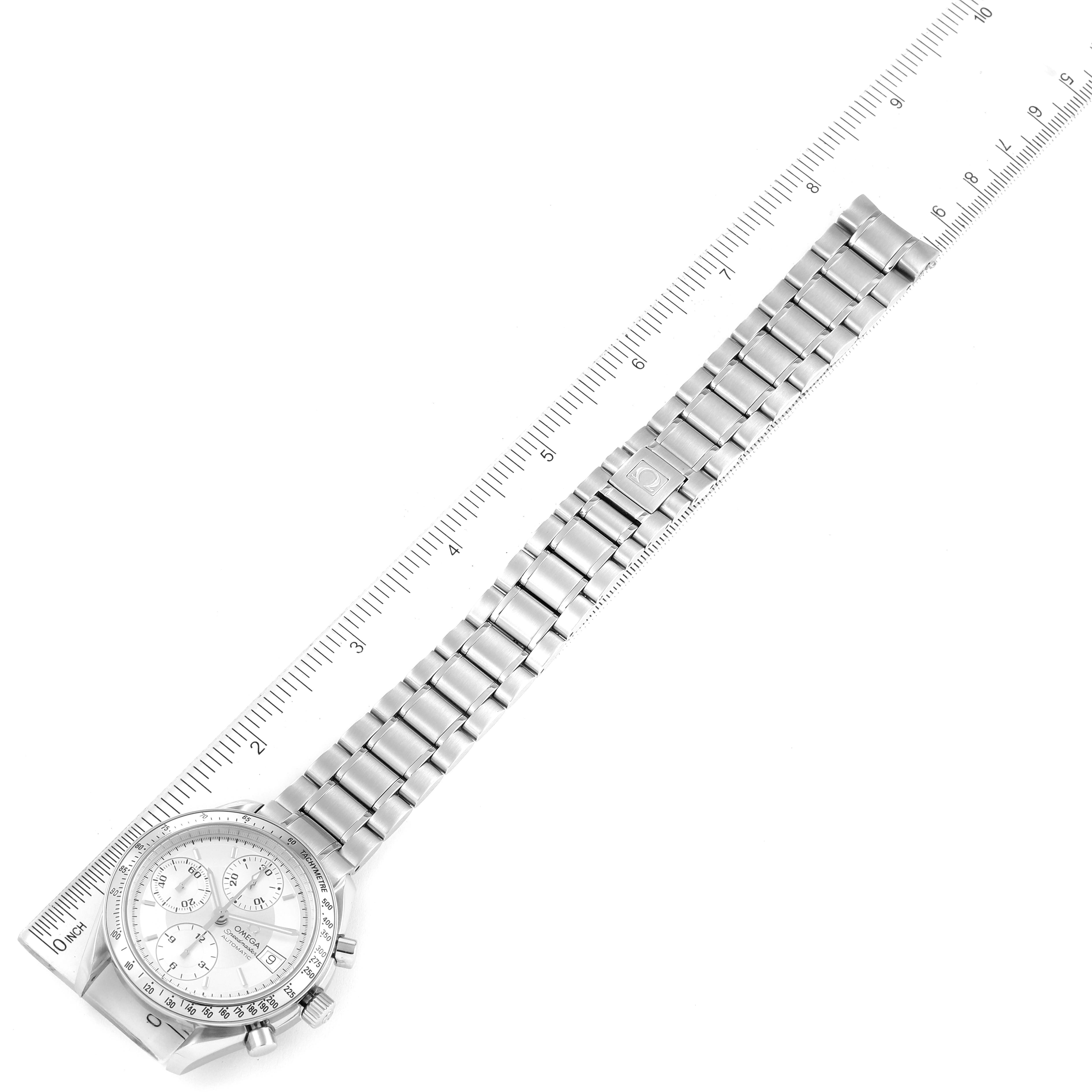 The image shows an Omega Speedmaster 3513.30.00 Men
s Stainless Steel Silver Dial 3513.30.00 Men
s Stainless Steel Silver Dial watch with a metal bracelet laid flat against a ruler, displaying its full face and strap length.
