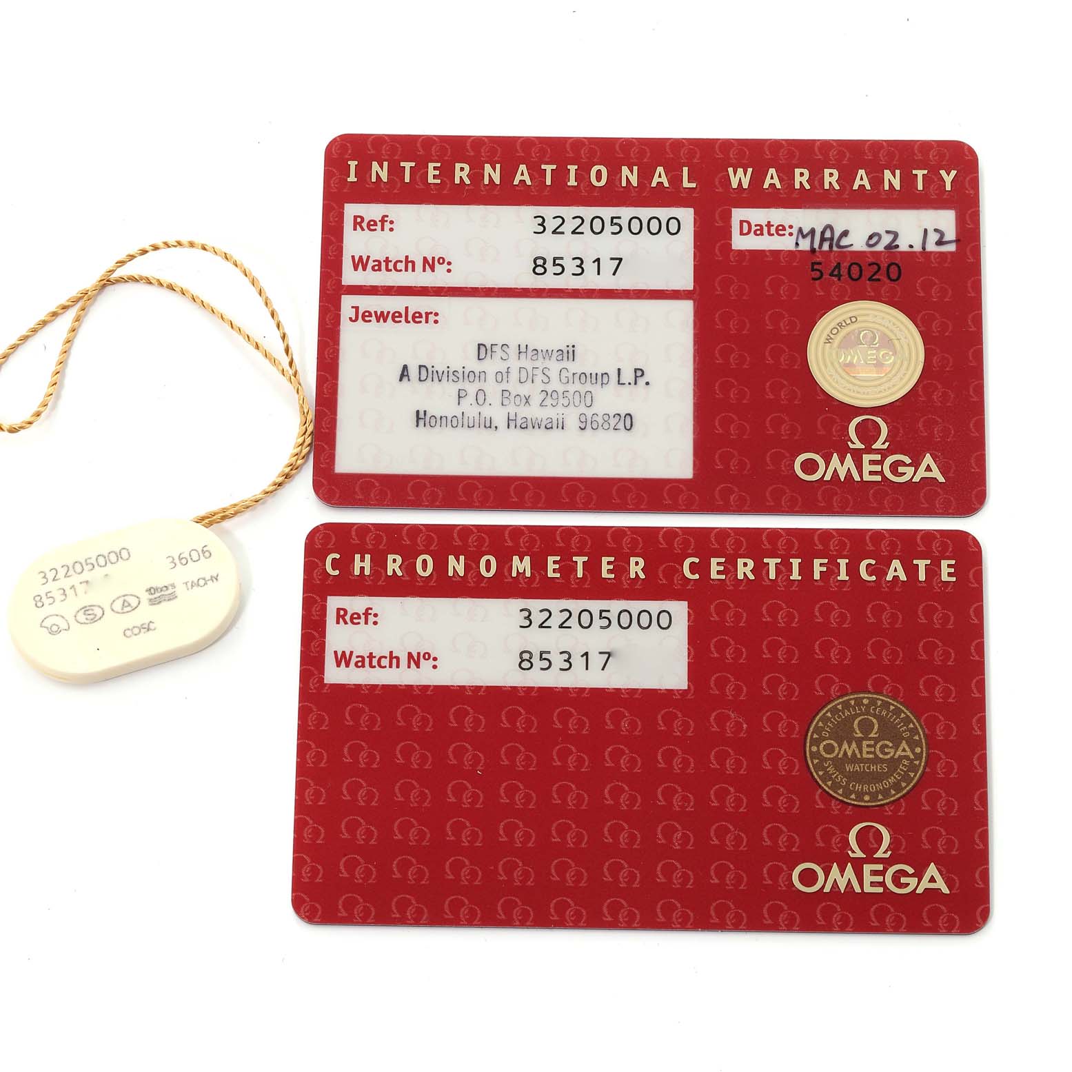 The image shows the International Warranty and Chronometer Certificate cards for an Omega Speedmaster 3220.50.00 Men
s Stainless Steel Black Dial 3220.50.00 Men
s Stainless Steel Black Dial watch along with a tag.