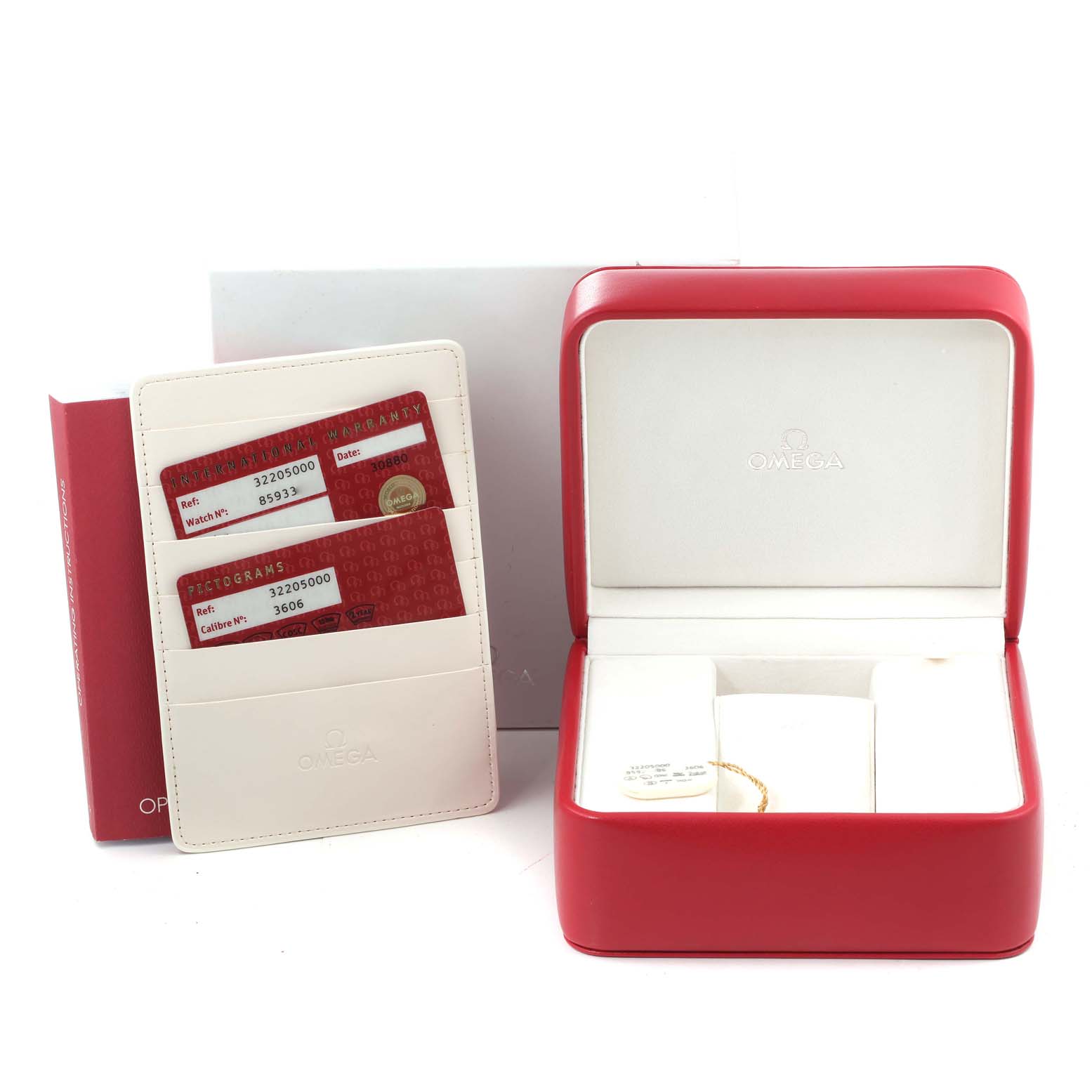 The image shows an Omega Speedmaster 3220.50.00 Men
s Stainless Steel Black Dial 3220.50.00 Men
s Stainless Steel Black Dial watch
s red box, open and empty, alongside warranty cards in a holder.