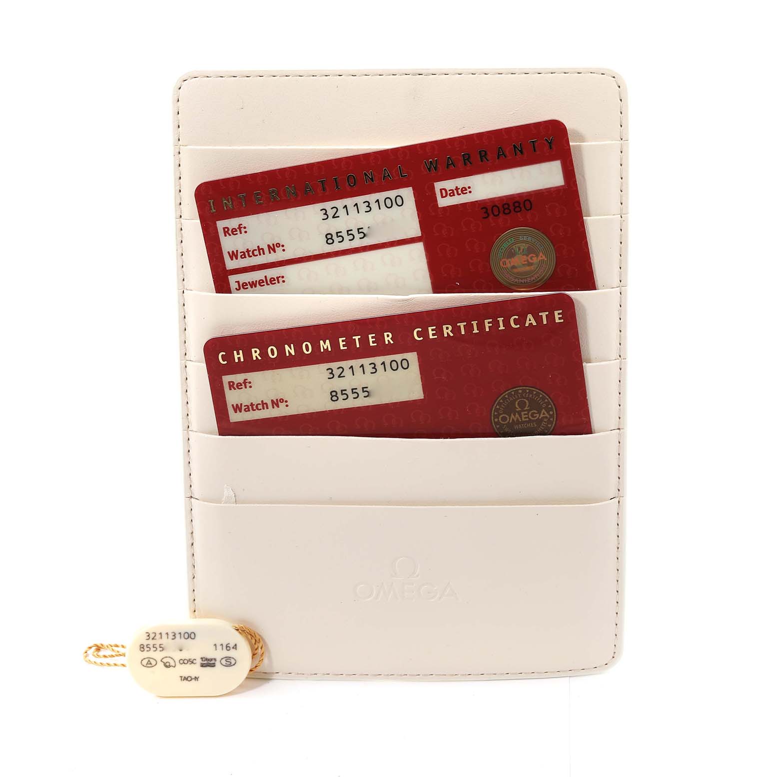 The image shows the warranty and chronometer certificate cards for an Omega Speedmaster 3211.31.00 Men
s Stainless Steel Silver Dial 3211.31.00 Men
s Stainless Steel Silver Dial, along with a corresponding tag.