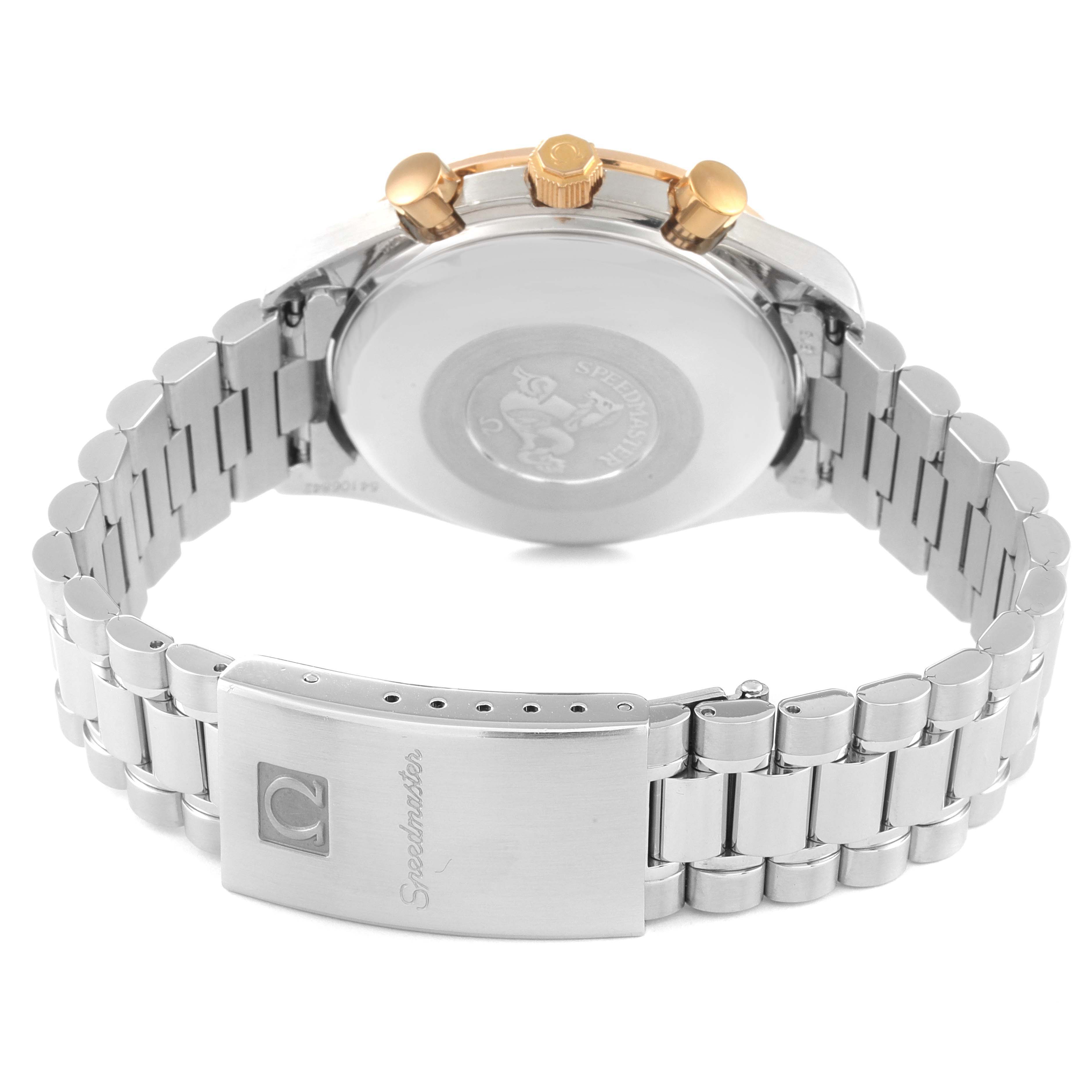 The image shows the backside and bracelet clasp of an Omega Speedmaster 3716.50.00 Men's Steel and Gold (two tone) Black Dial 3716.50.00 Men's Steel and Gold (two tone) Black Dial watch, with the brand's engraving and detailed metal links.