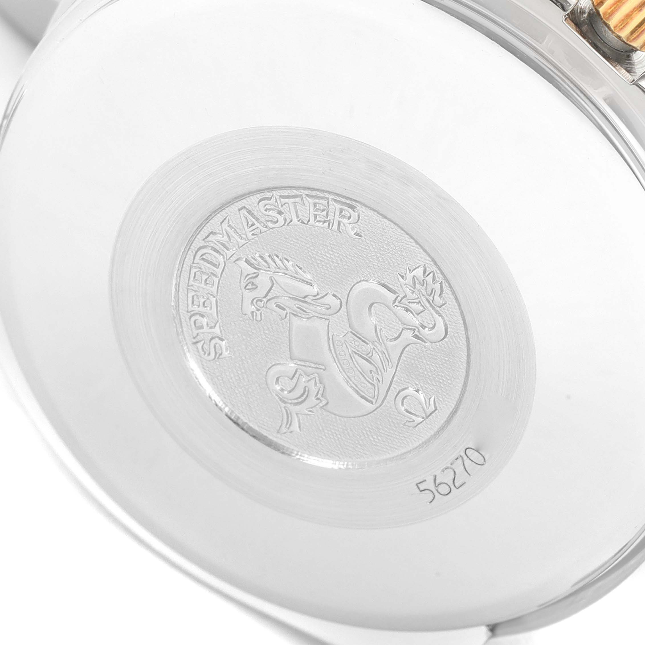 The image shows the case back of an Omega Speedmaster 3313.50.00 Men
s Steel and Gold (two tone) Black Dial 3313.50.00 Men
s Steel and Gold (two tone) Black Dial watch, featuring the engraved logo and serial number.