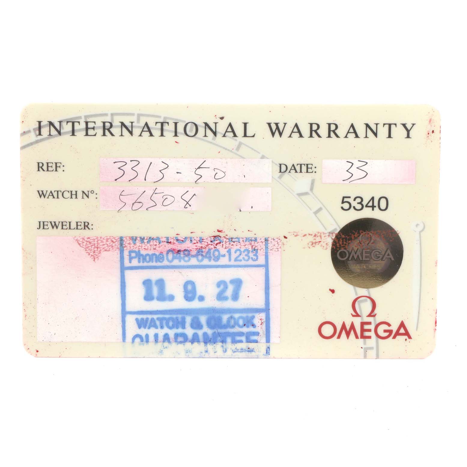 The image shows an international warranty card for an Omega Speedmaster 3313.50.00 Men's Steel and Gold (two tone) Black Dial 3313.50.00 Men's Steel and Gold (two tone) Black Dial watch, displaying reference and watch numbers.