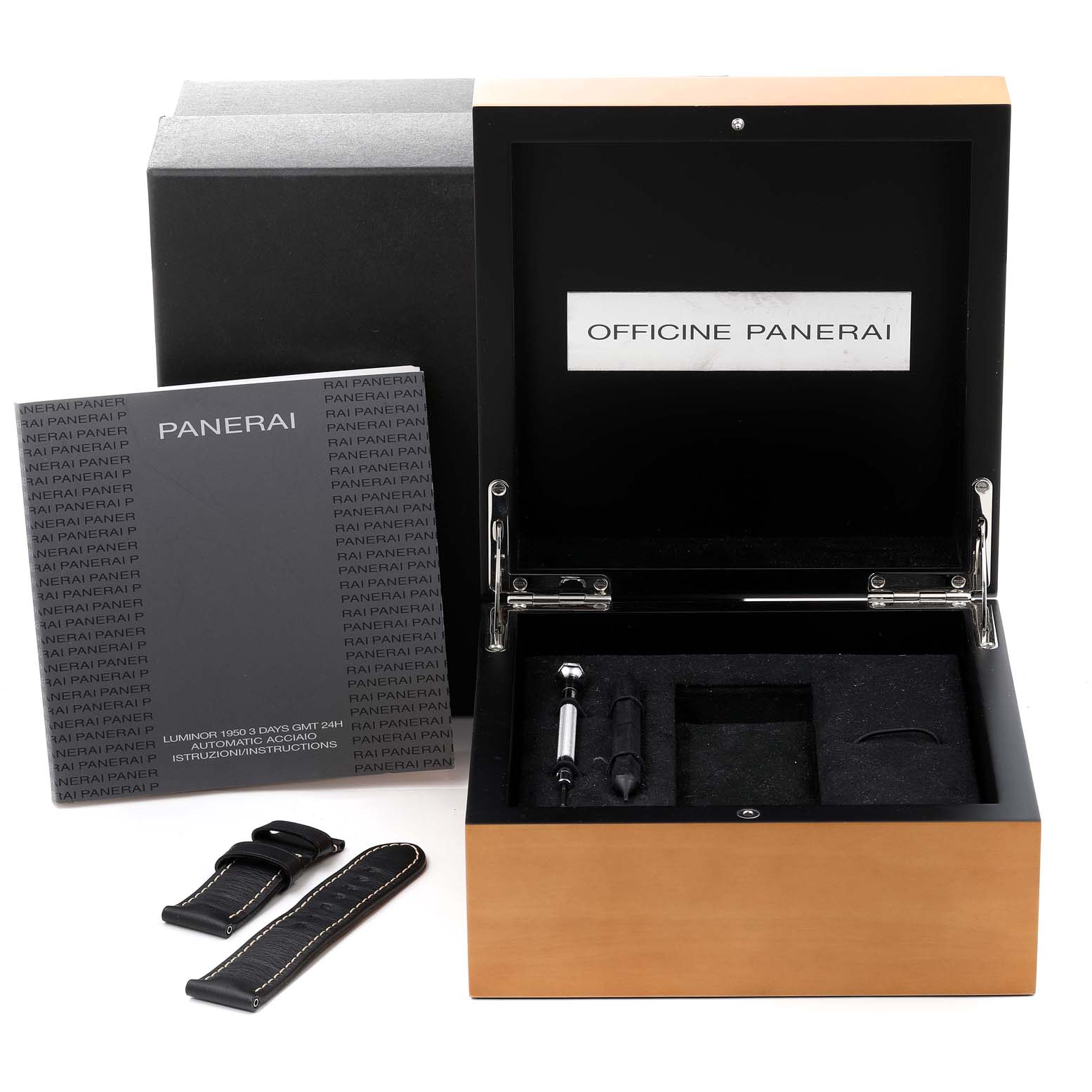 The image shows a Panerai Luminor PAM00531 Men
s Stainless Steel Black Dial PAM00531 Men
s Stainless Steel Black Dial watch box set including a manual, extra straps, and tools, viewed from above.