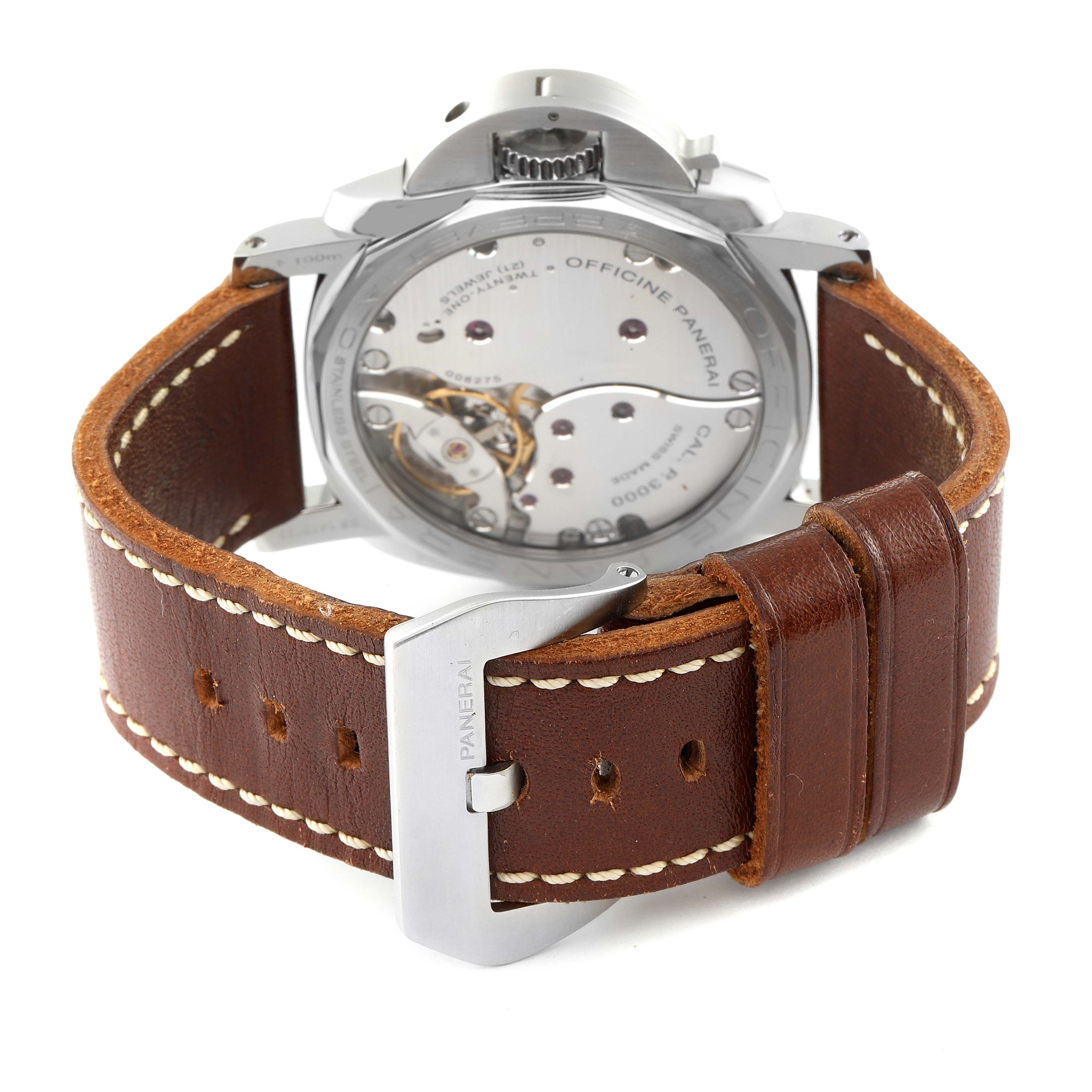 The image shows the back view of the Panerai Luminor PAM00372 Men
s Stainless Steel Black Dial PAM00372 Men
s Stainless Steel Black Dial watch, highlighting the exposed movement and brown leather strap with stitching.