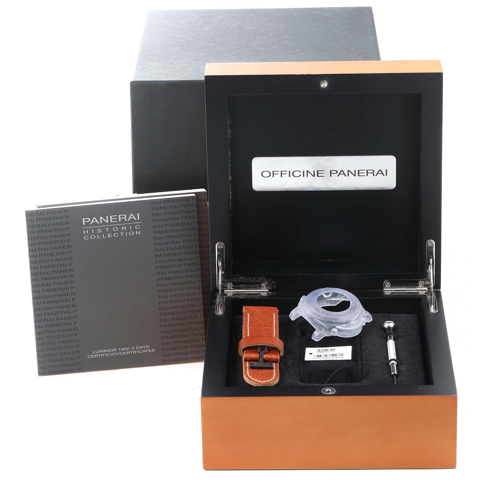 The image shows an open Panerai Luminor PAM00372 Men
s Stainless Steel Black Dial PAM00372 Men
s Stainless Steel Black Dial watch case with accessories, a manual, a strap, and a tool.