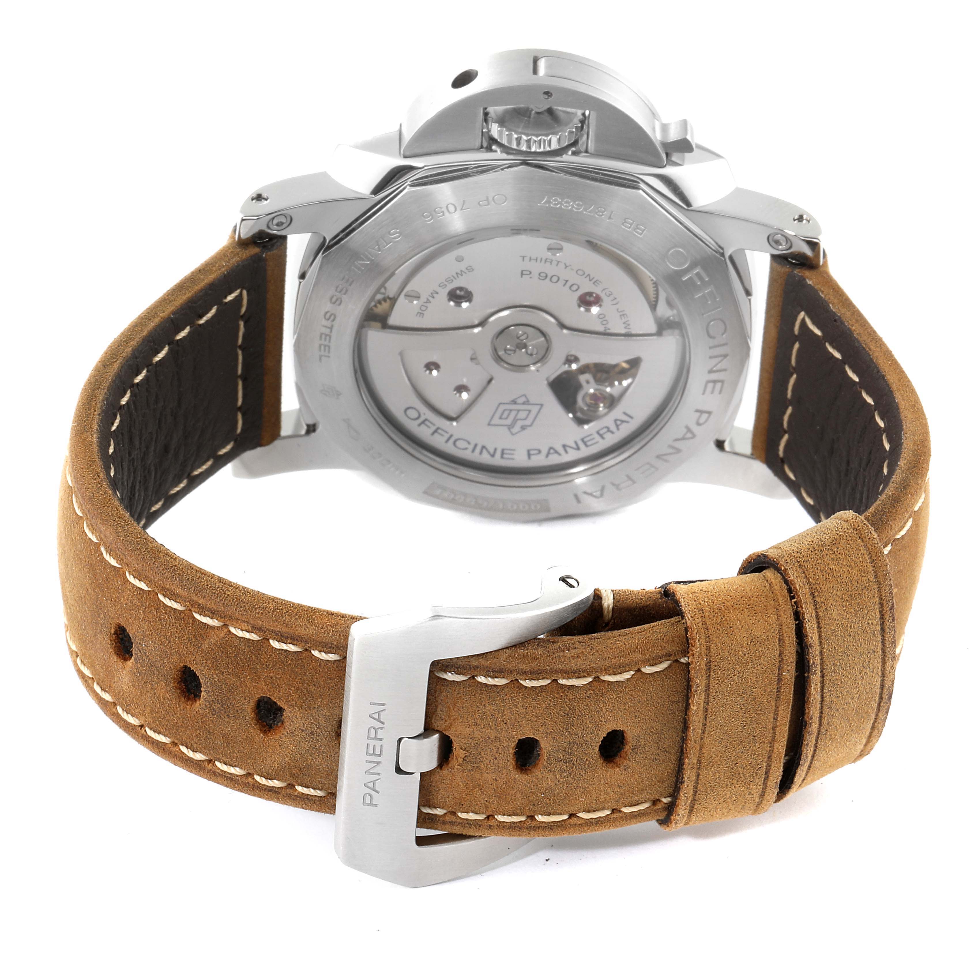 The image shows the back view of a Panerai Luminor PAM01499 Men
s Stainless Steel White Dial PAM01499 Men
s Stainless Steel White Dial watch, highlighting the movement through the case back and the leather strap with the Panerai buckle.