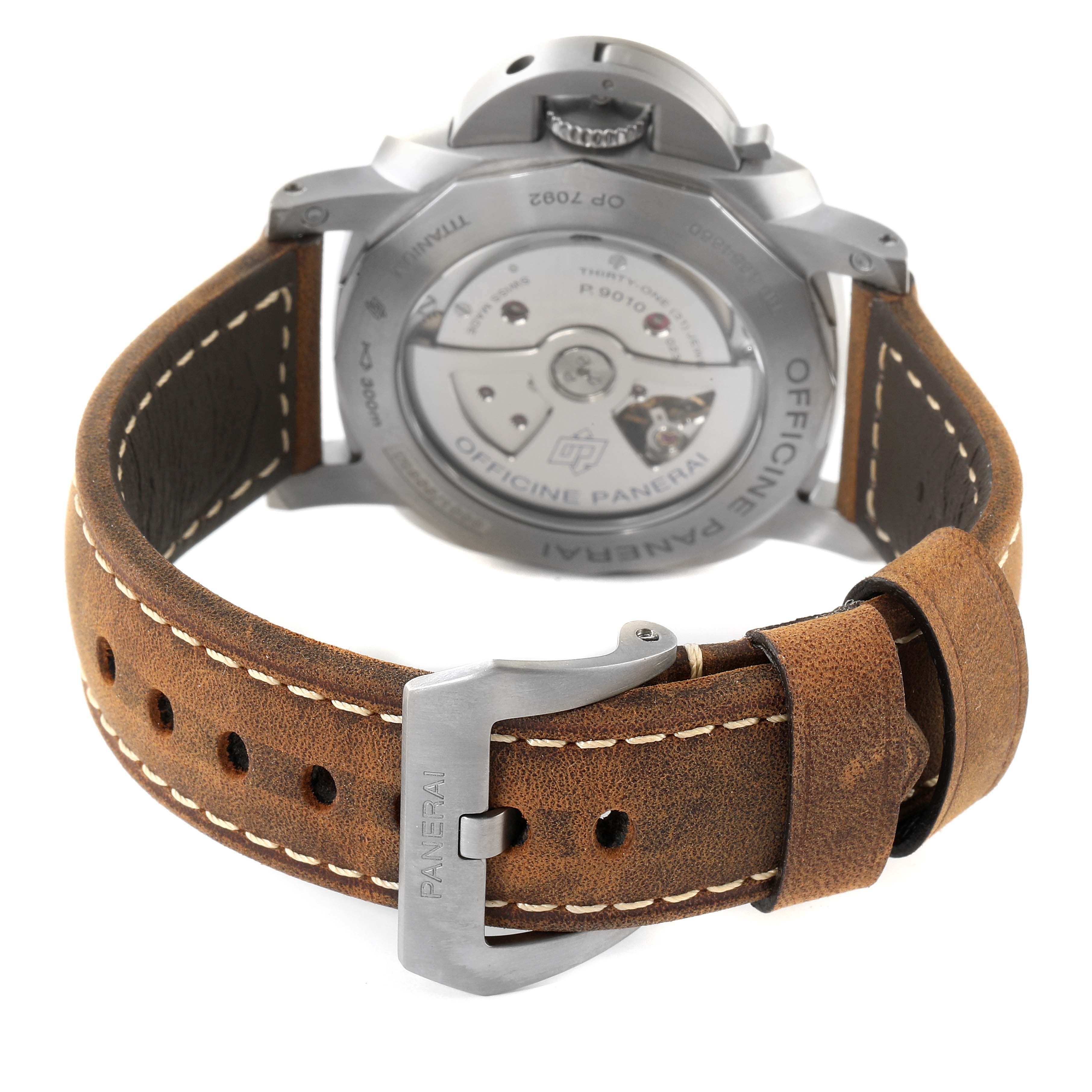 The image shows the back view of a Panerai Luminor PAM01351 Men's Titanium Brown Dial PAM01351 Men's Titanium Brown Dial watch, highlighting the movement and leather strap with buckle.