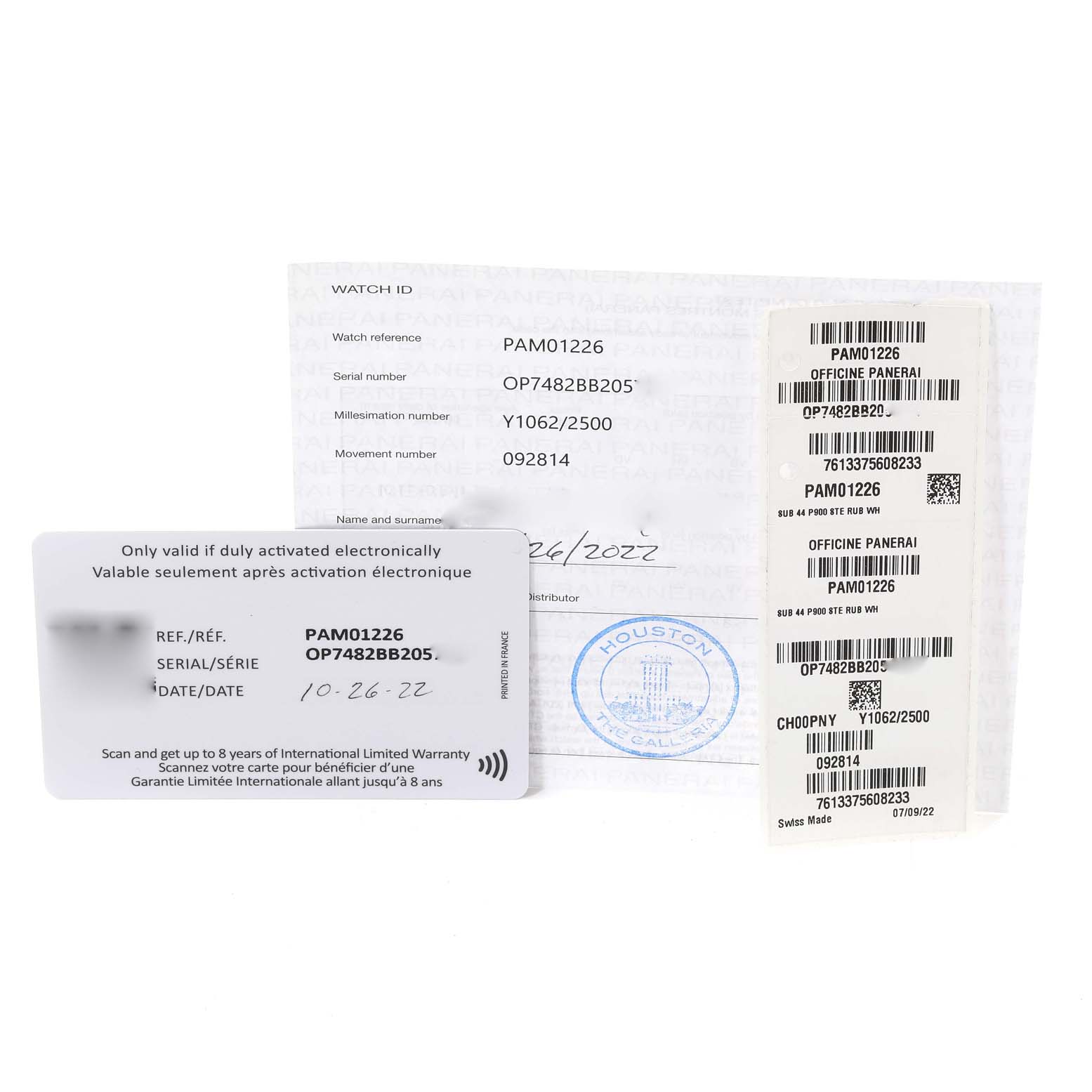 The image shows documentation and warranty cards for a Panerai Submersible PAM01226 Men
s Stainless Steel White Dial PAM01226 Men
s Stainless Steel White Dial model PAM01226, including serial and reference numbers.