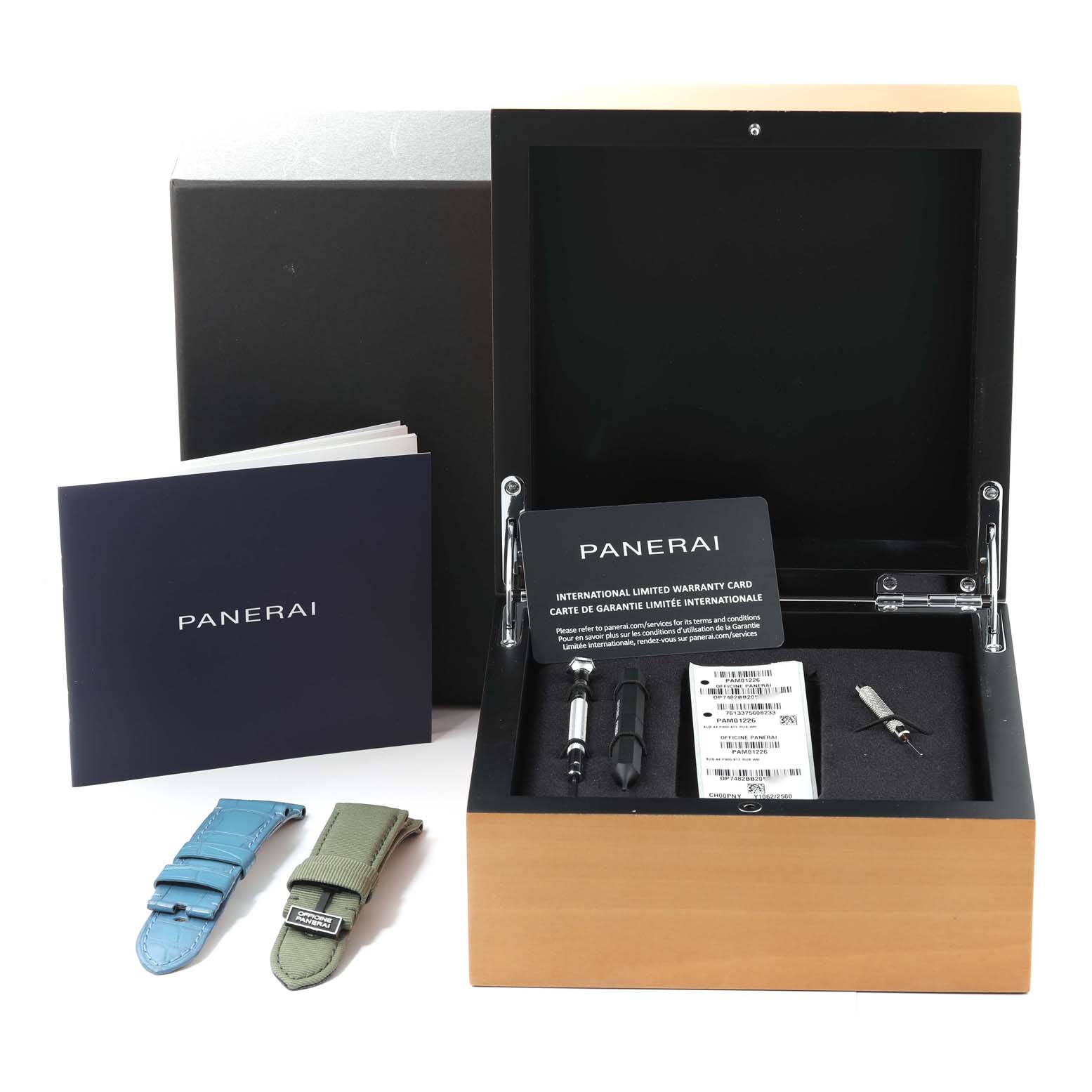 This image displays the Panerai Submersible PAM01226 Men
s Stainless Steel White Dial PAM01226 Men
s Stainless Steel White Dial watch box, warranty cards, tools, and extra straps from a front angle.
