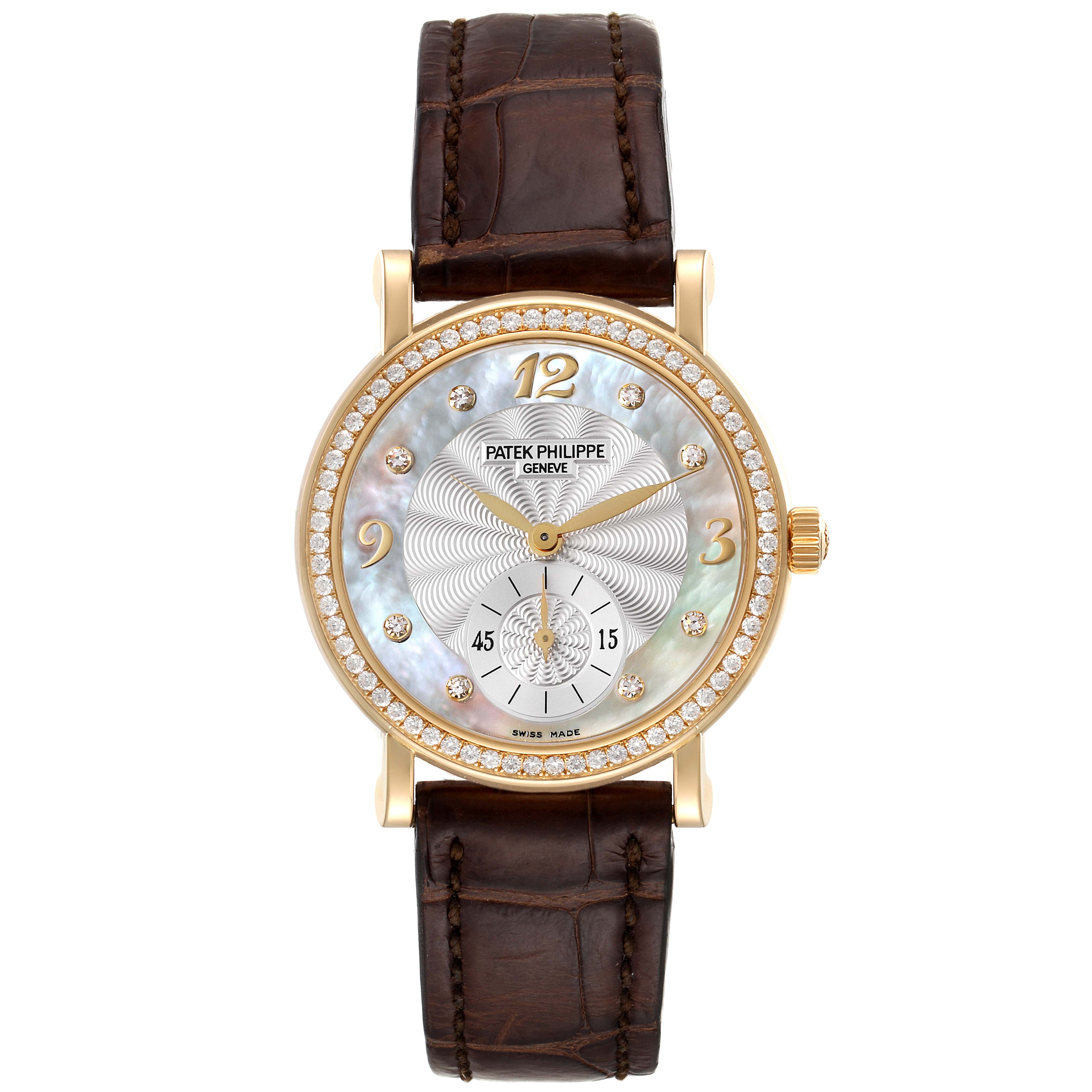 The image shows a front view of a Patek Philippe Calatrava 4959J Women's Yellow Gold Mother of Pearl Dial 4959J Women's Yellow Gold Mother of Pearl Dial watch with a brown leather strap and a diamond-studded bezel.