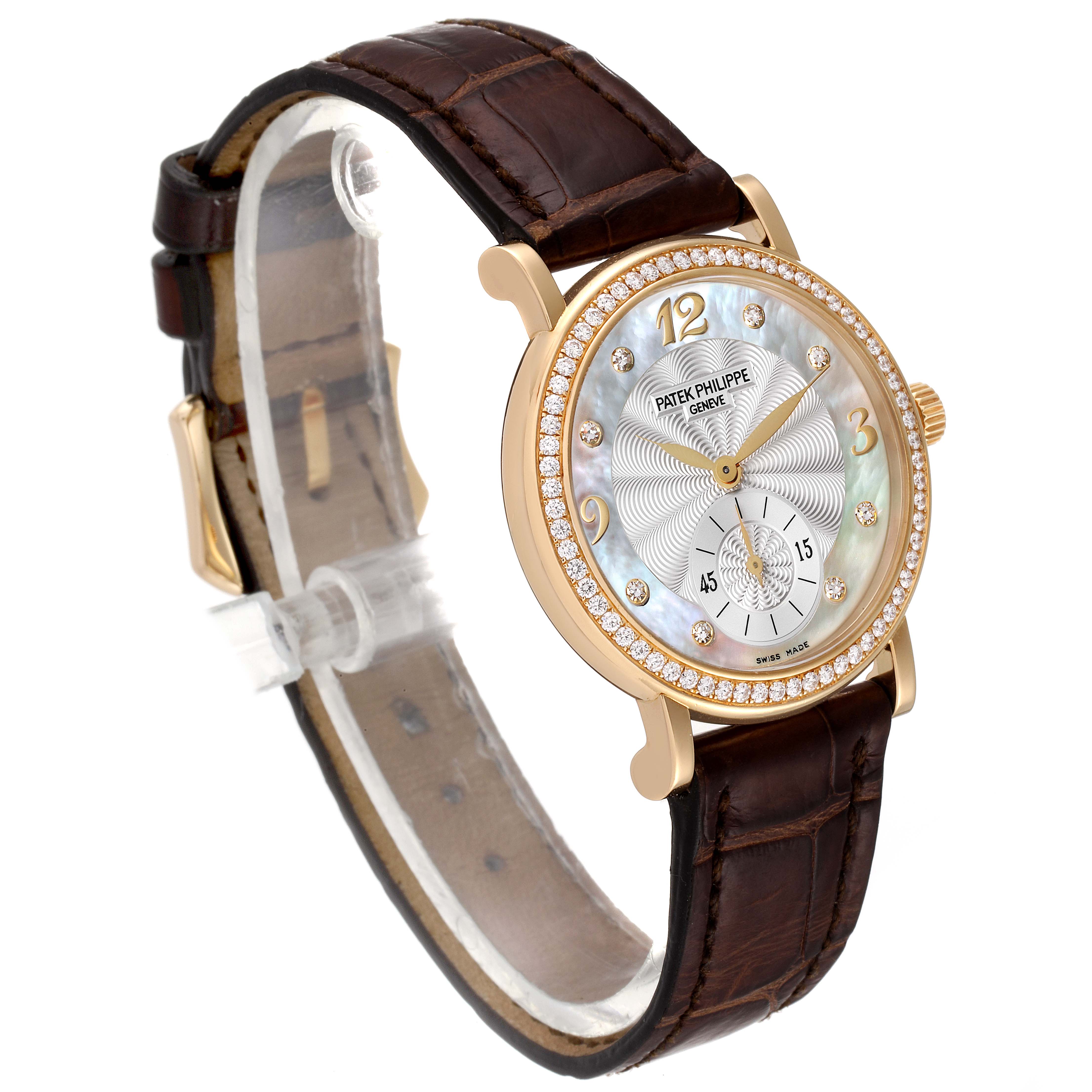 The image shows a Patek Philippe Calatrava 4959J Women's Yellow Gold Mother of Pearl Dial 4959J Women's Yellow Gold Mother of Pearl Dial watch angled slightly to the left, highlighting its dial, bezel, crown, and brown leather strap.