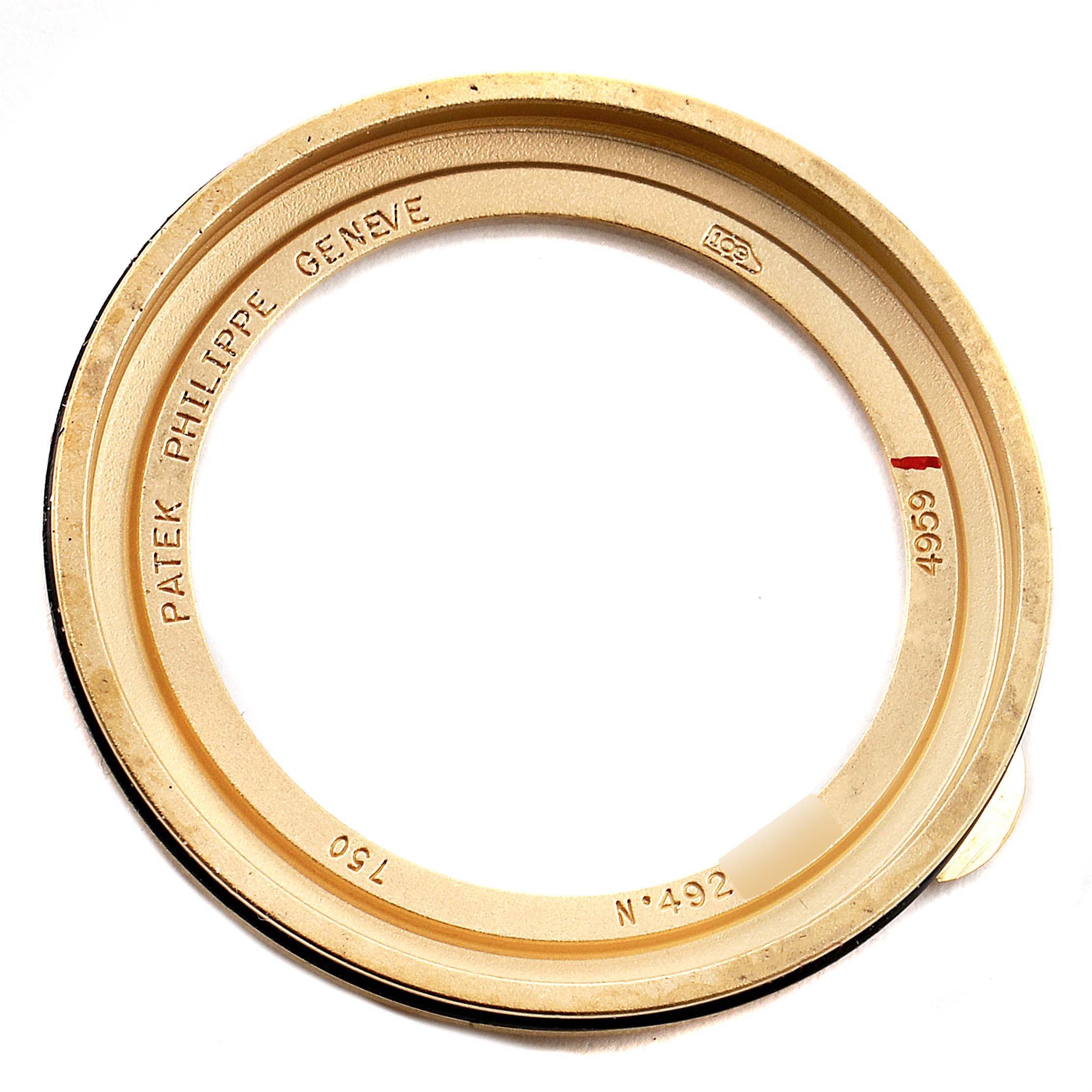 This image shows a close-up view of the bezel from a Patek Philippe Calatrava 4959J Women's Yellow Gold Mother of Pearl Dial 4959J Women's Yellow Gold Mother of Pearl Dial watch.