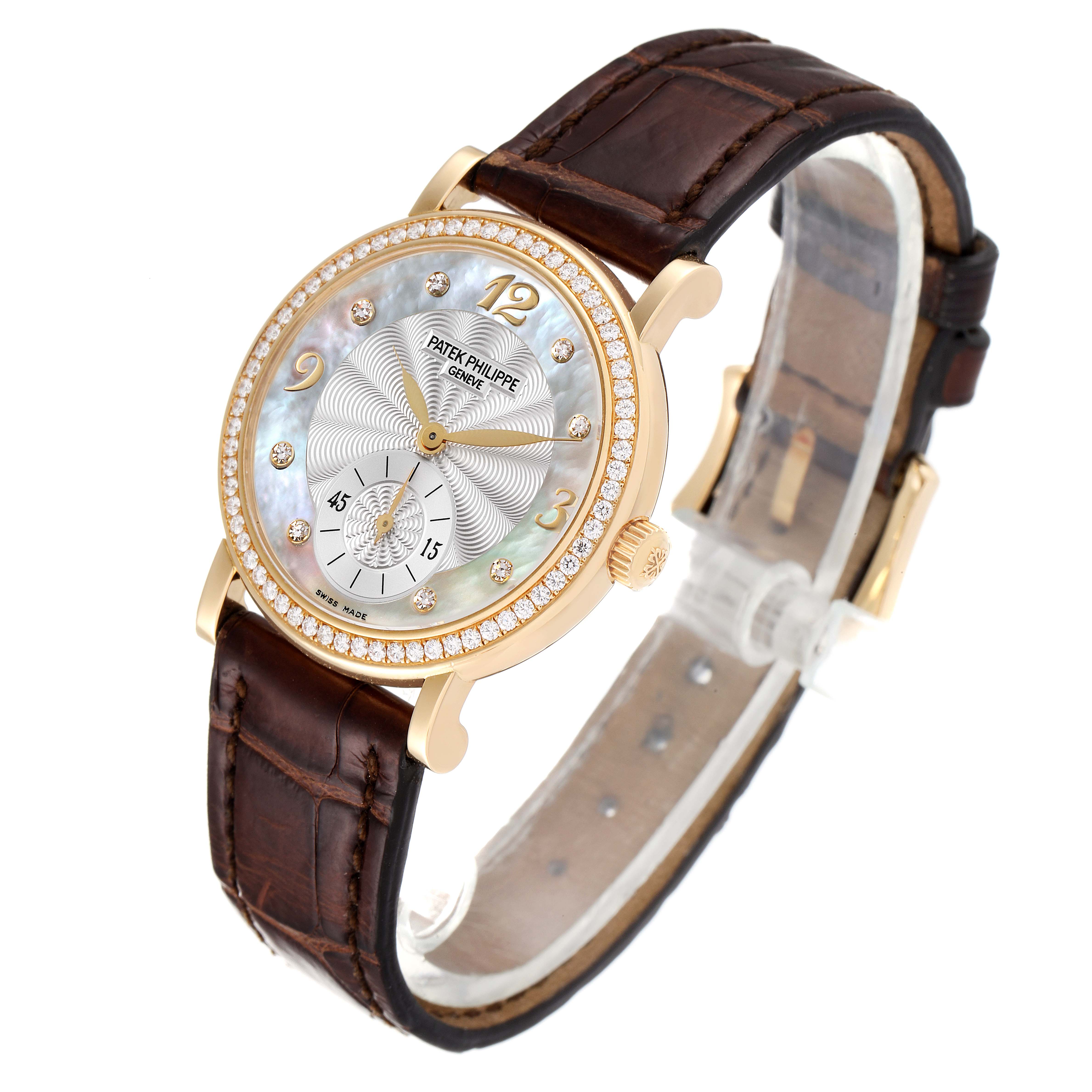 The image shows a Patek Philippe Calatrava 4959J Women's Yellow Gold Mother of Pearl Dial 4959J Women's Yellow Gold Mother of Pearl Dial watch at a slight angle, highlighting the face, bezel, crown, and brown leather strap.