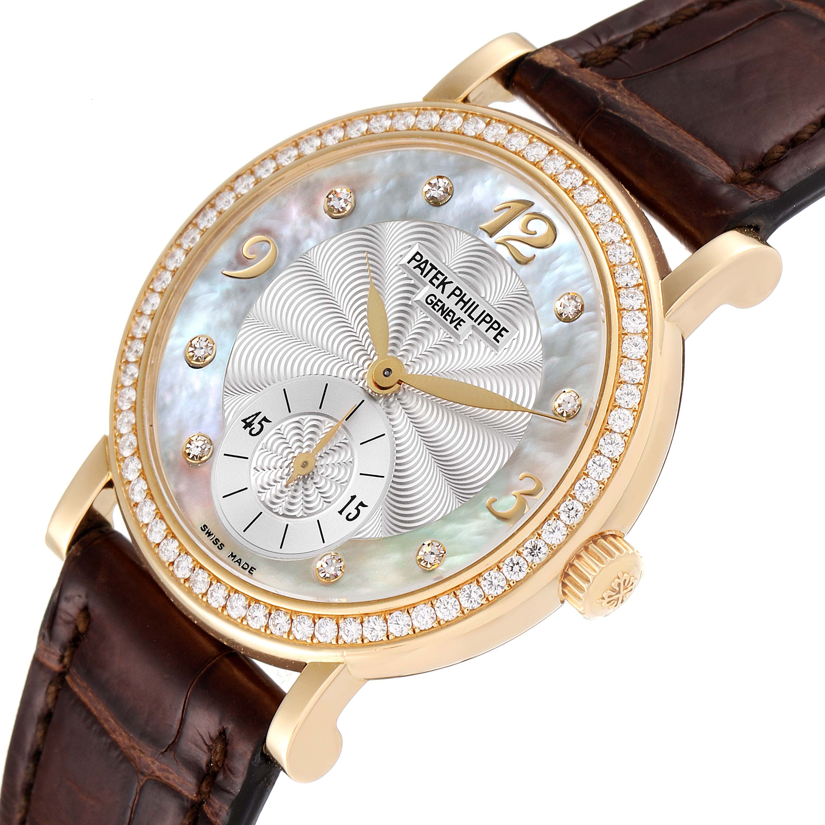 The image shows a Patek Philippe Calatrava 4959J Women's Yellow Gold Mother of Pearl Dial 4959J Women's Yellow Gold Mother of Pearl Dial watch at an angled close-up, highlighting its face, dial, crown, and leather strap.